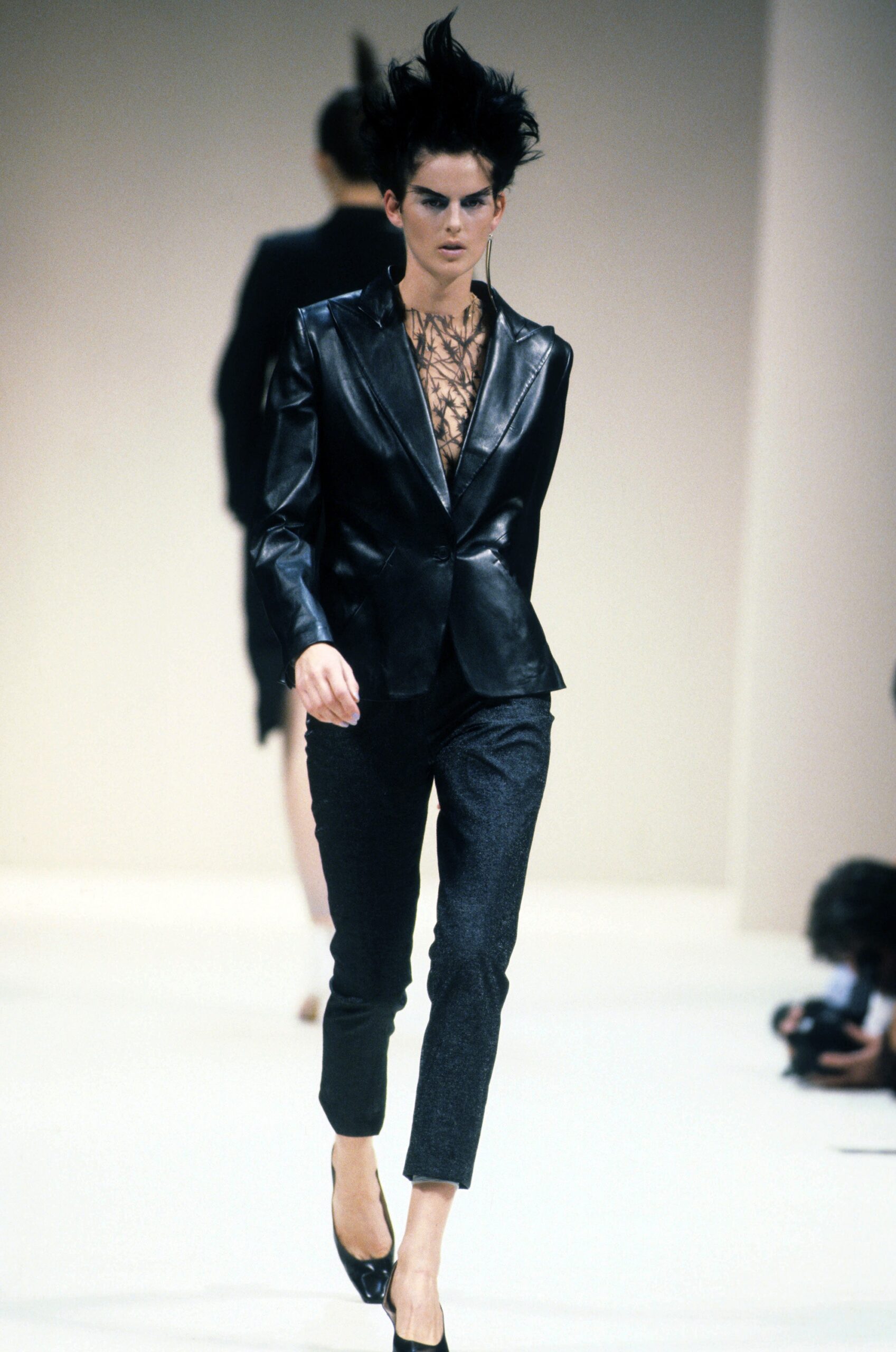 black leather tailored blazer and gray slim pants