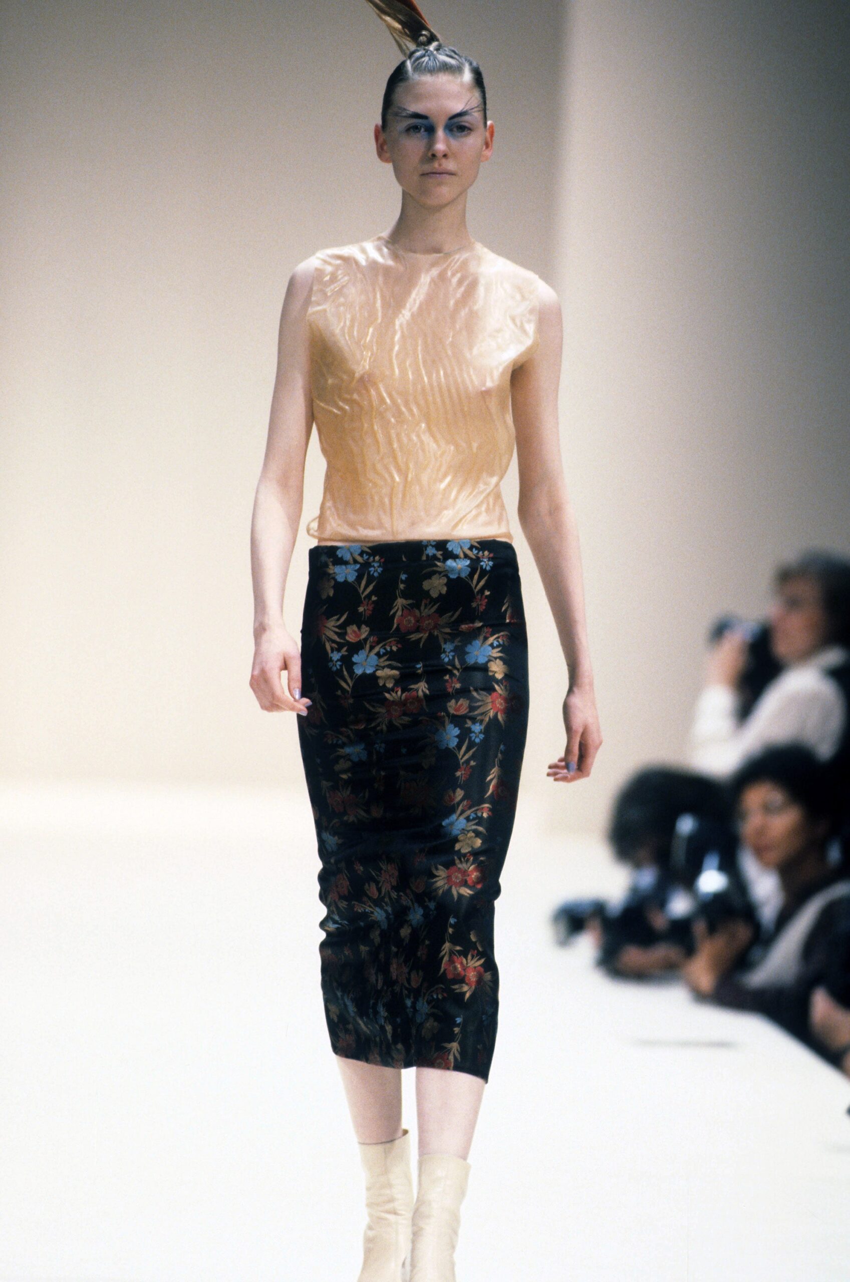 beige silk sleeveless top and black pencil skirt