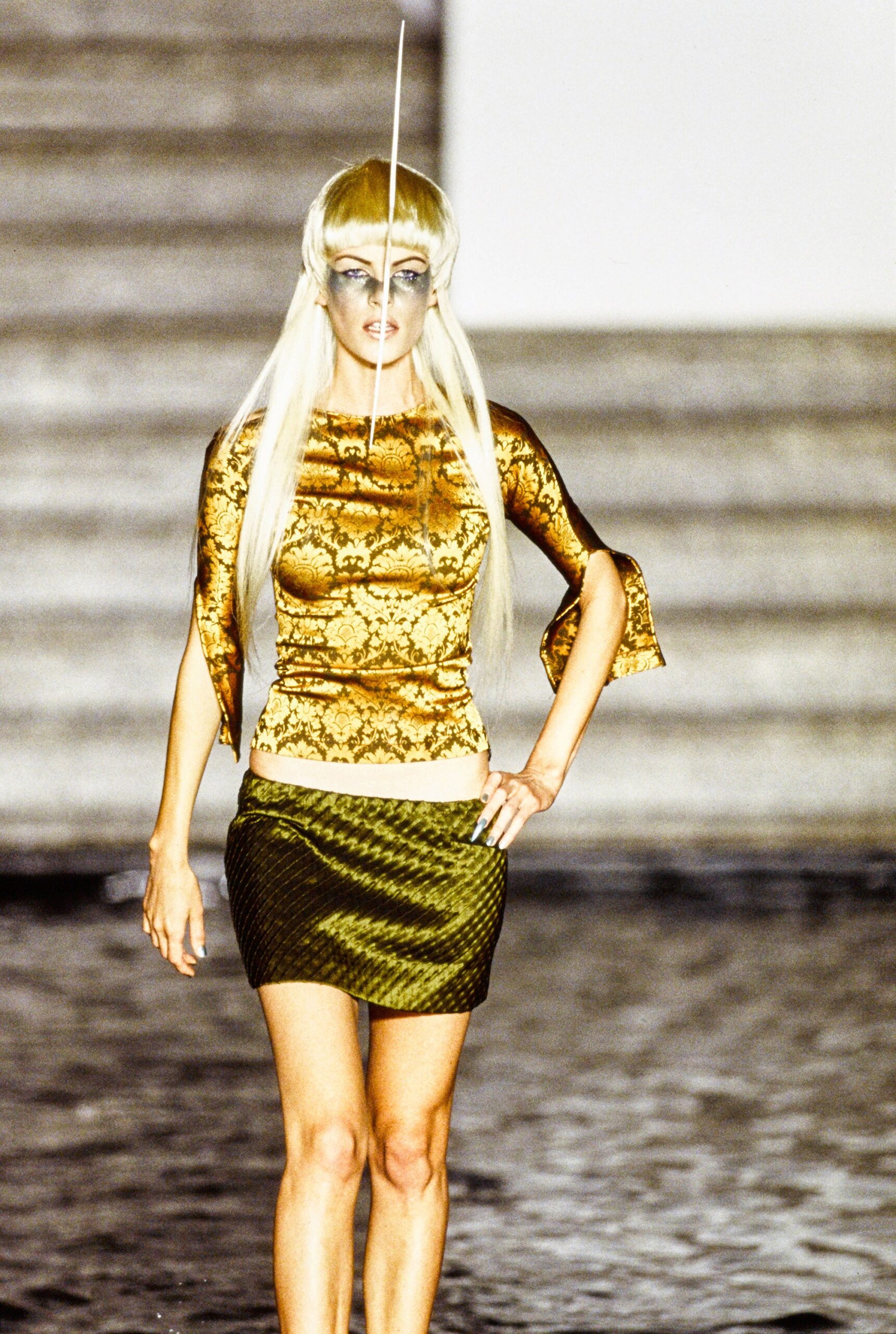 gold embroidered fitted top with green pencil skirt