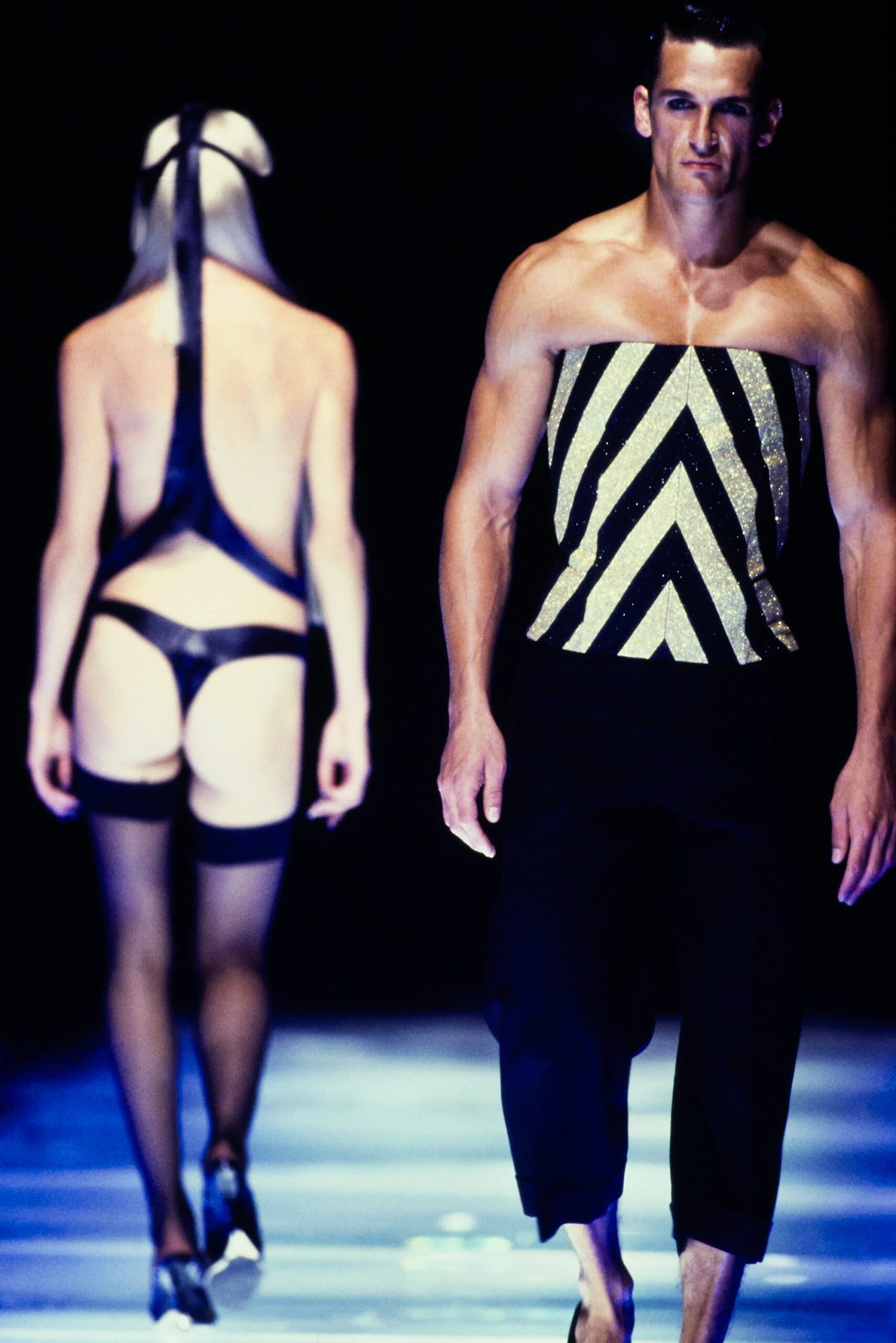 black and gold fitted top with cropped pants