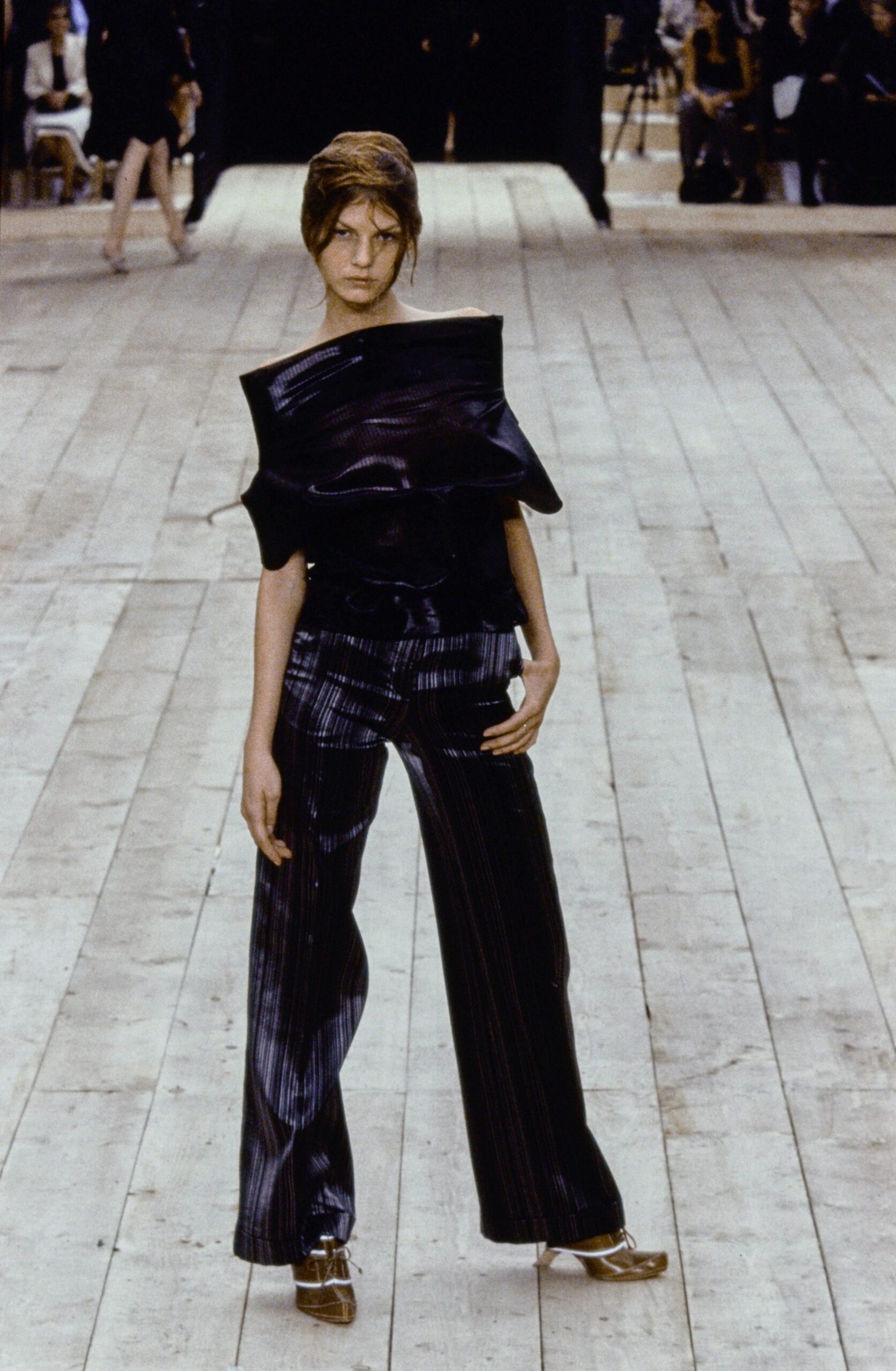 black silk fitted top and wide-leg pants