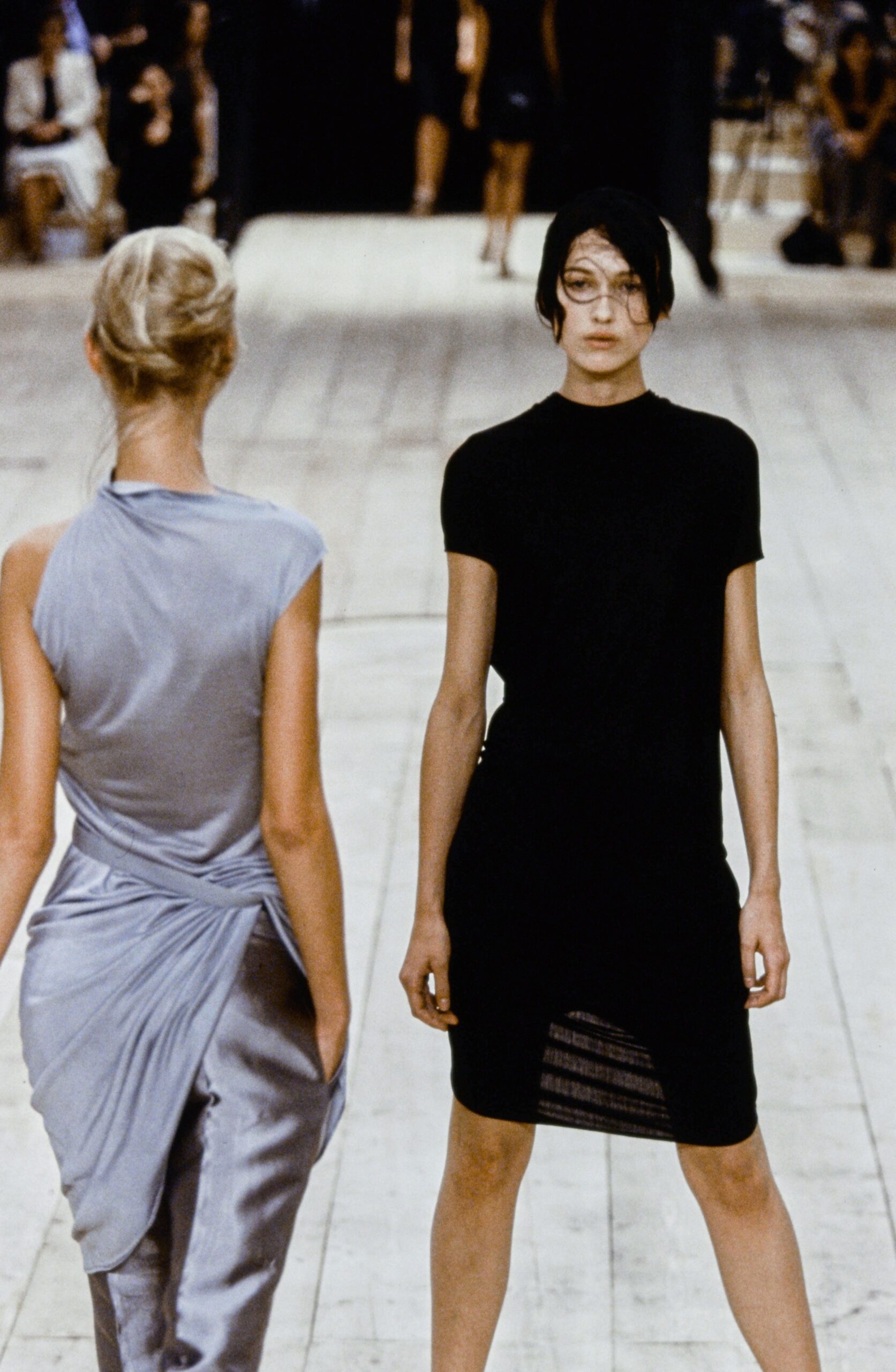 black fitted mini dress and gray draped midi dress