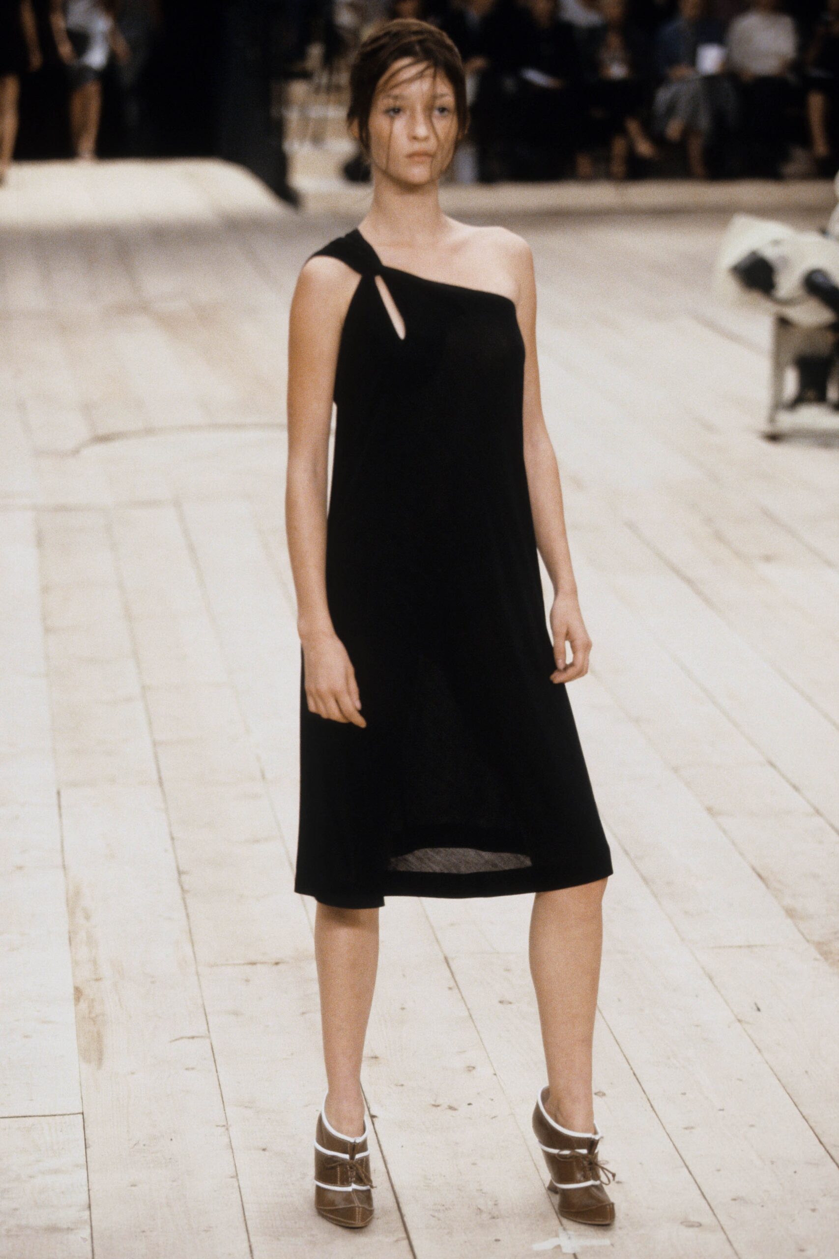black asymmetric dress with platform shoes