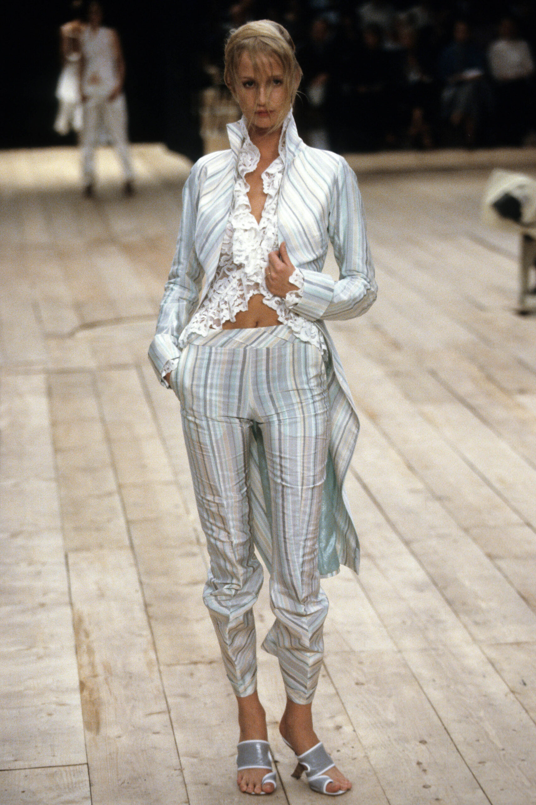 white ruffled blouse with blue striped pants