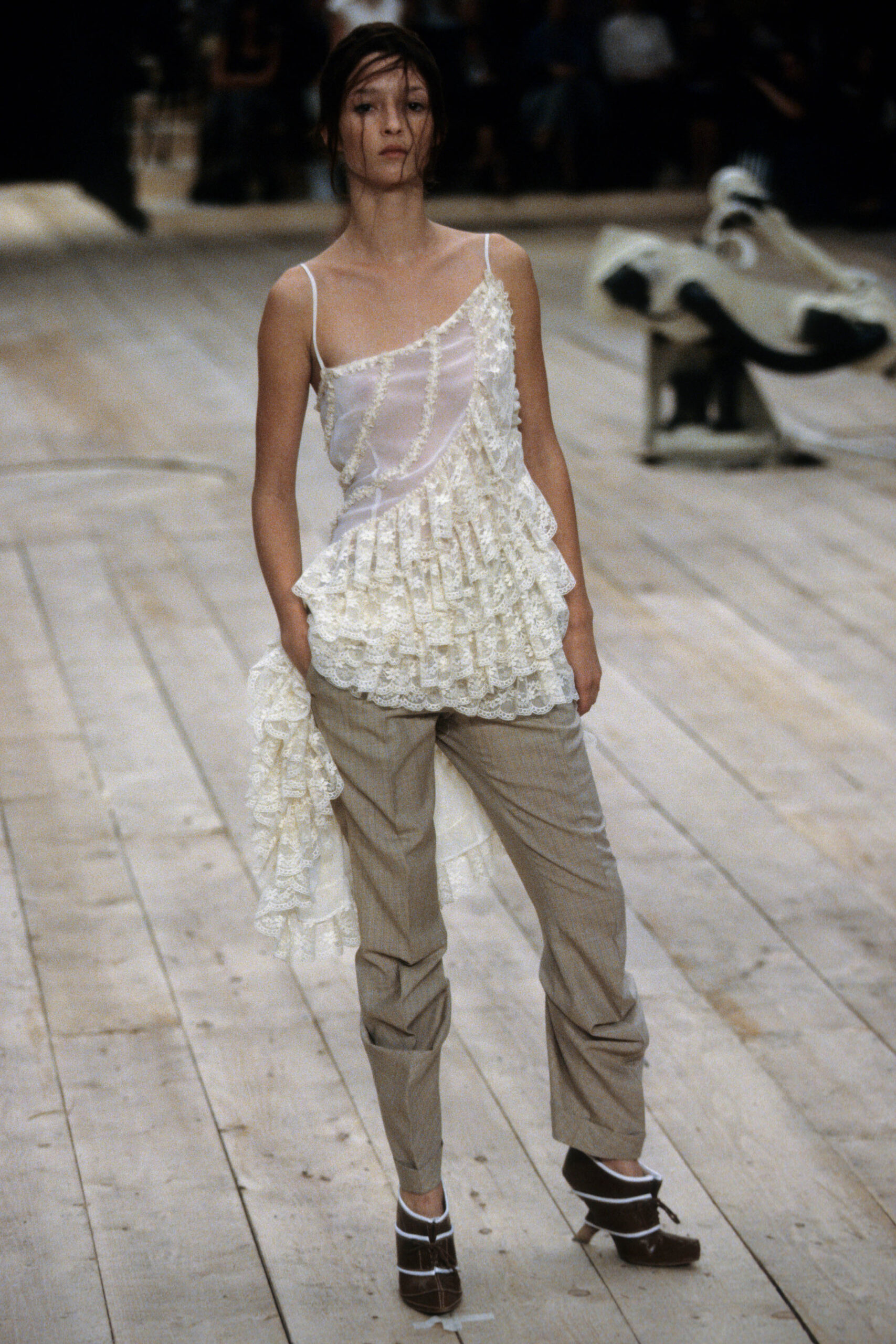 white ruffled top with beige pants
