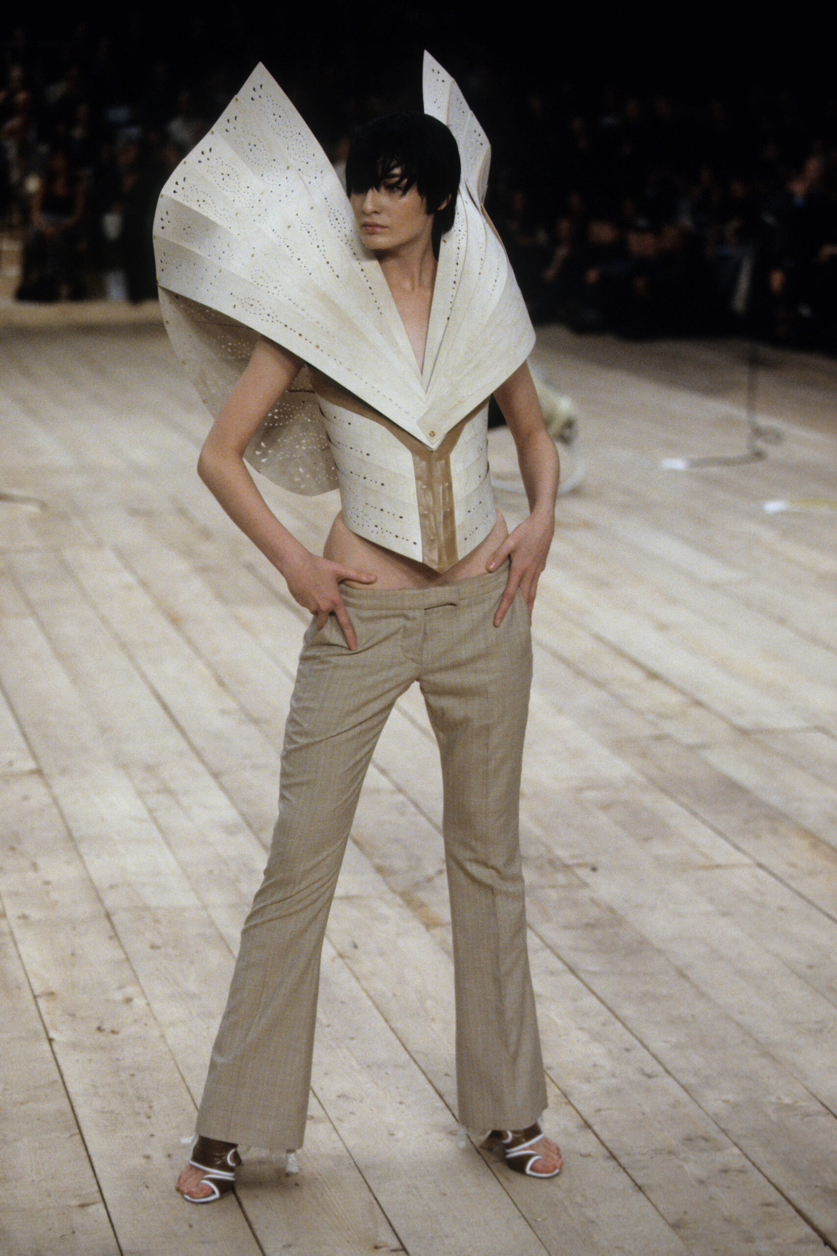 beige corset and tailored pants