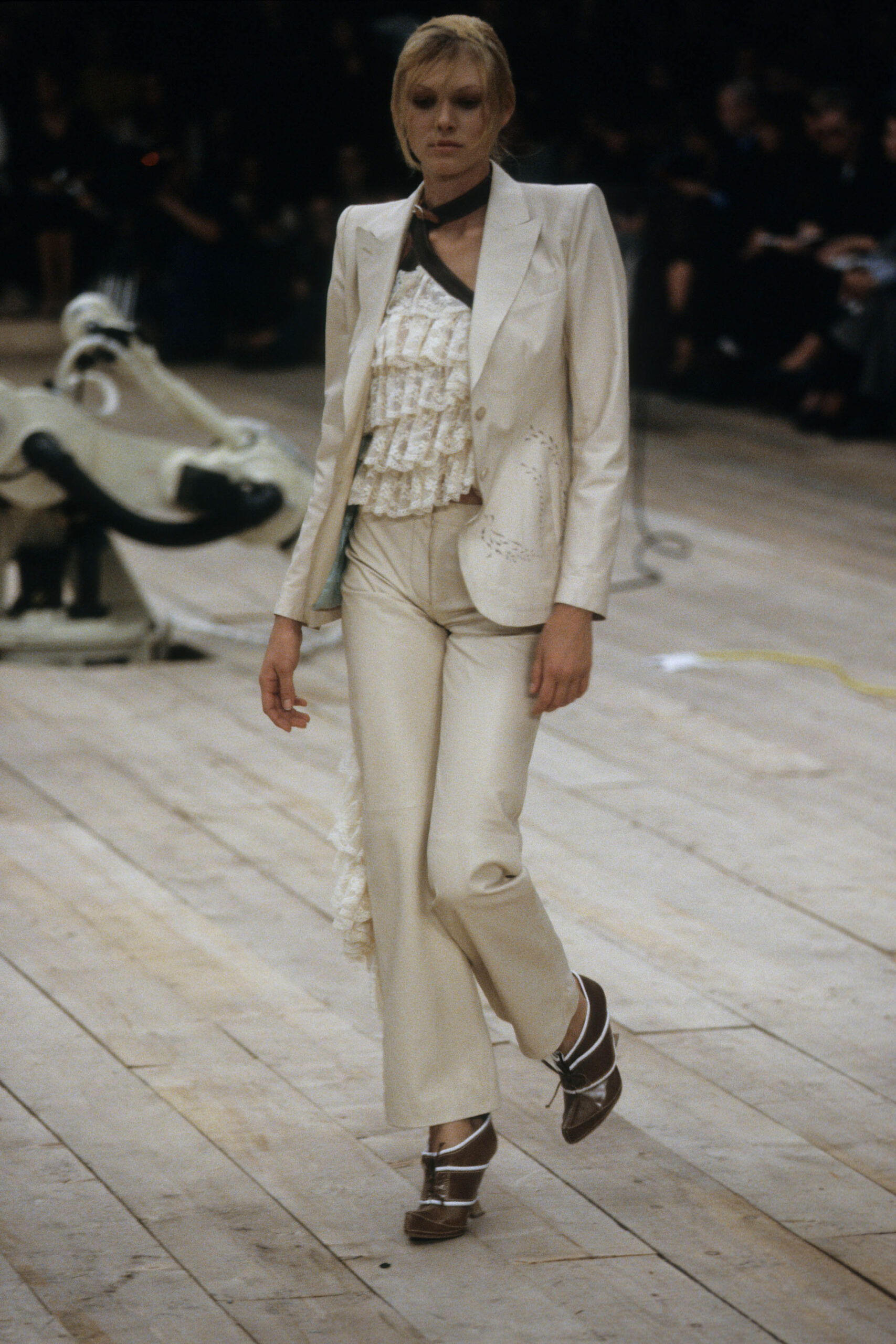 white tailored suit with ruffled top
