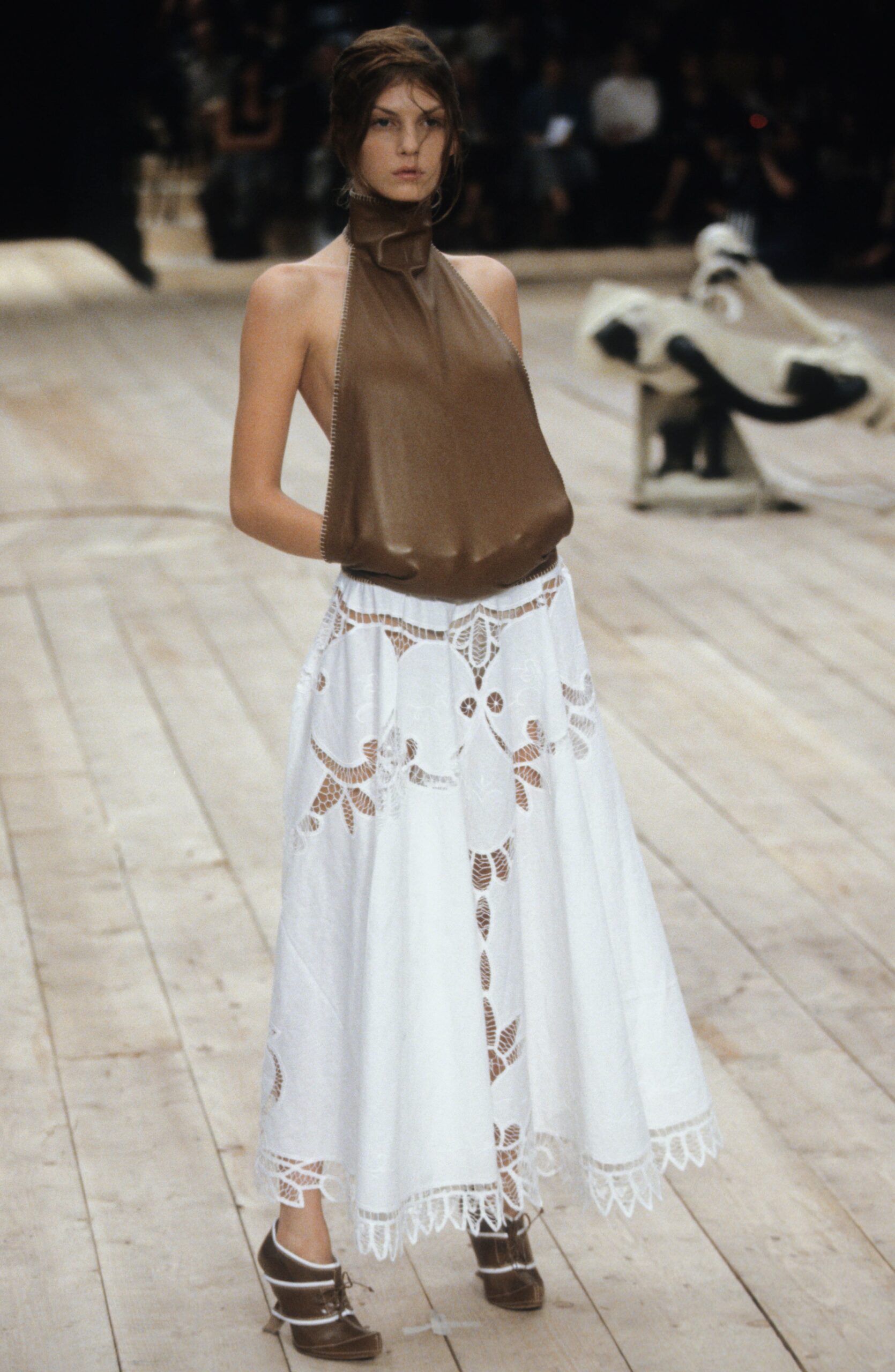 brown silk sleeveless top and white embroidered skirt