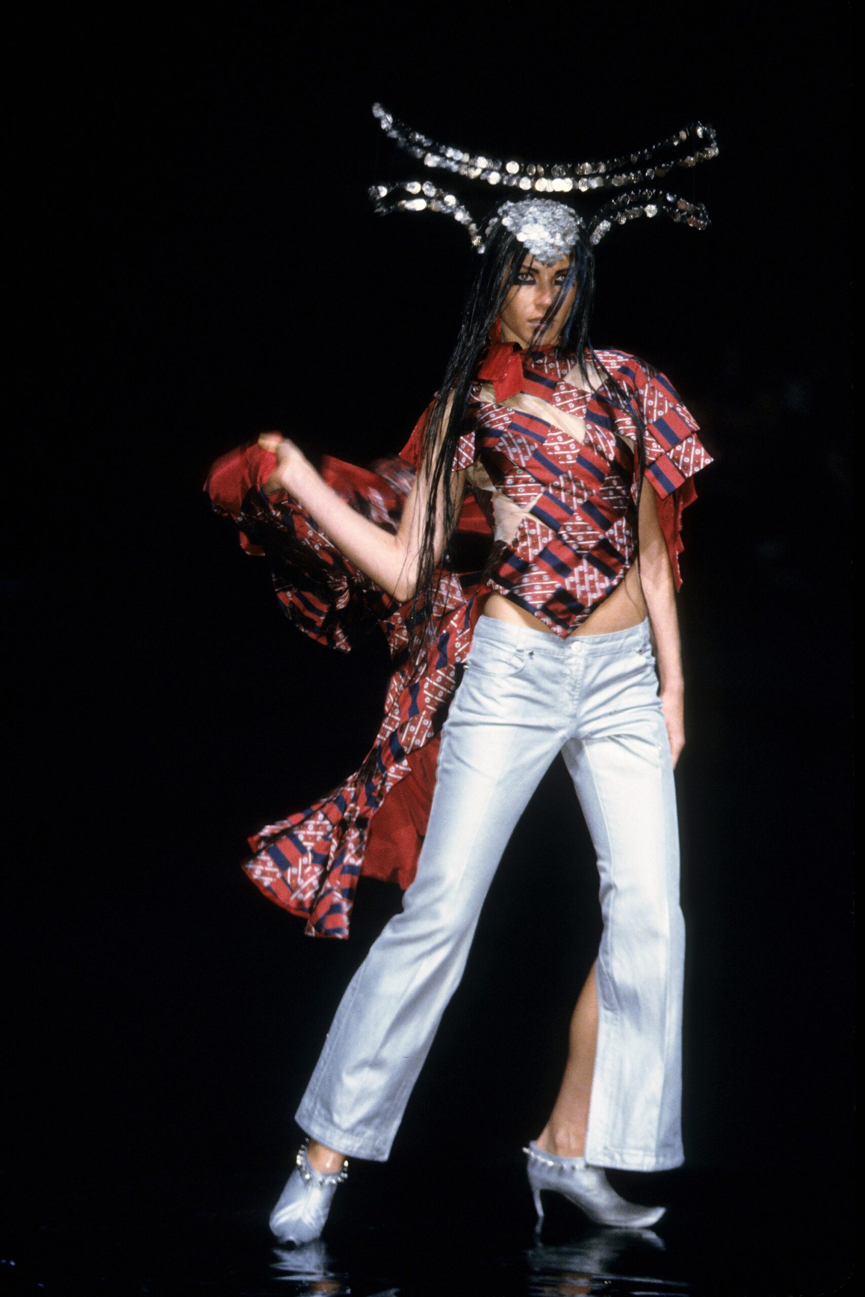 fitted red silk top with flared silver pants