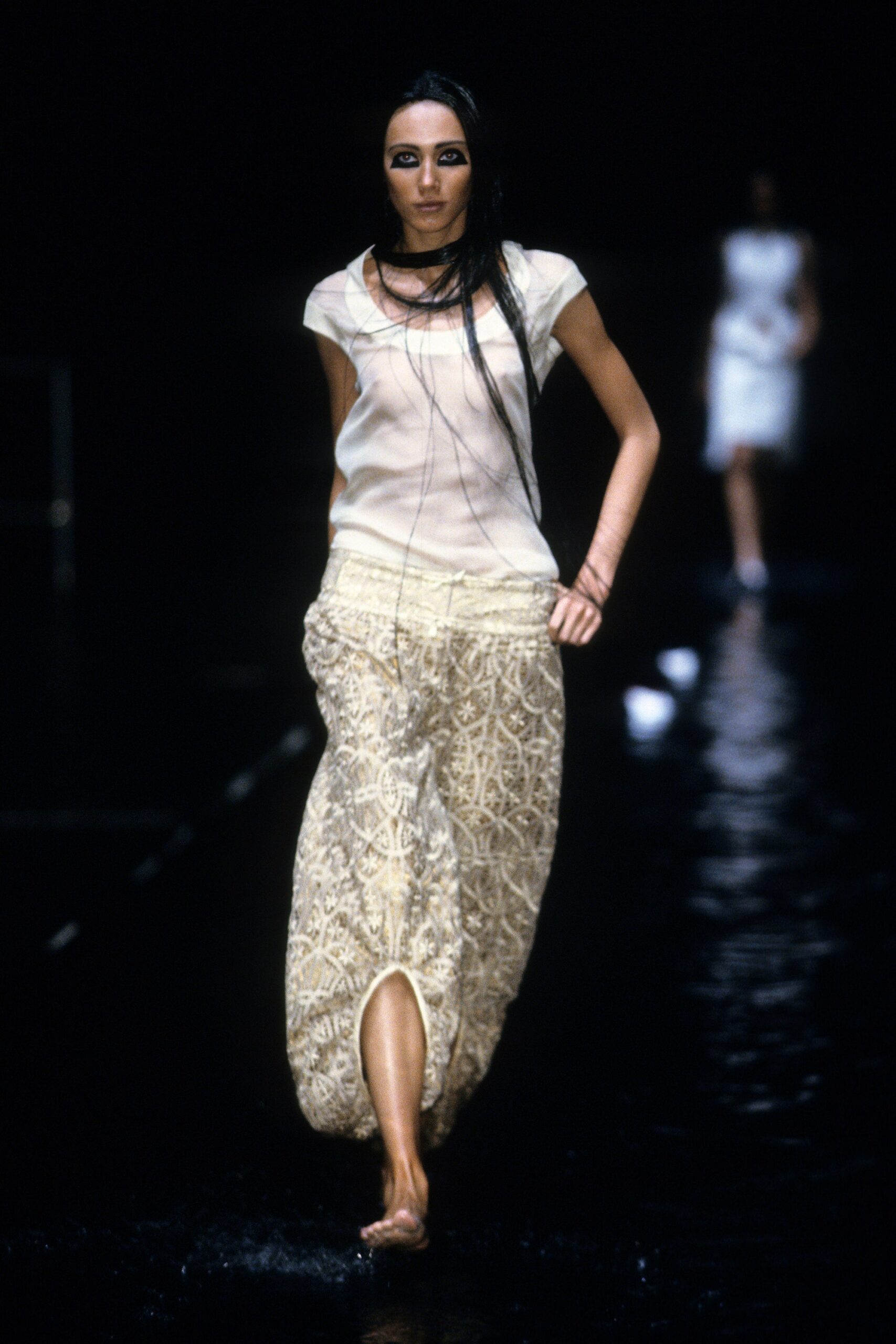 white silk top and beige embroidered pants