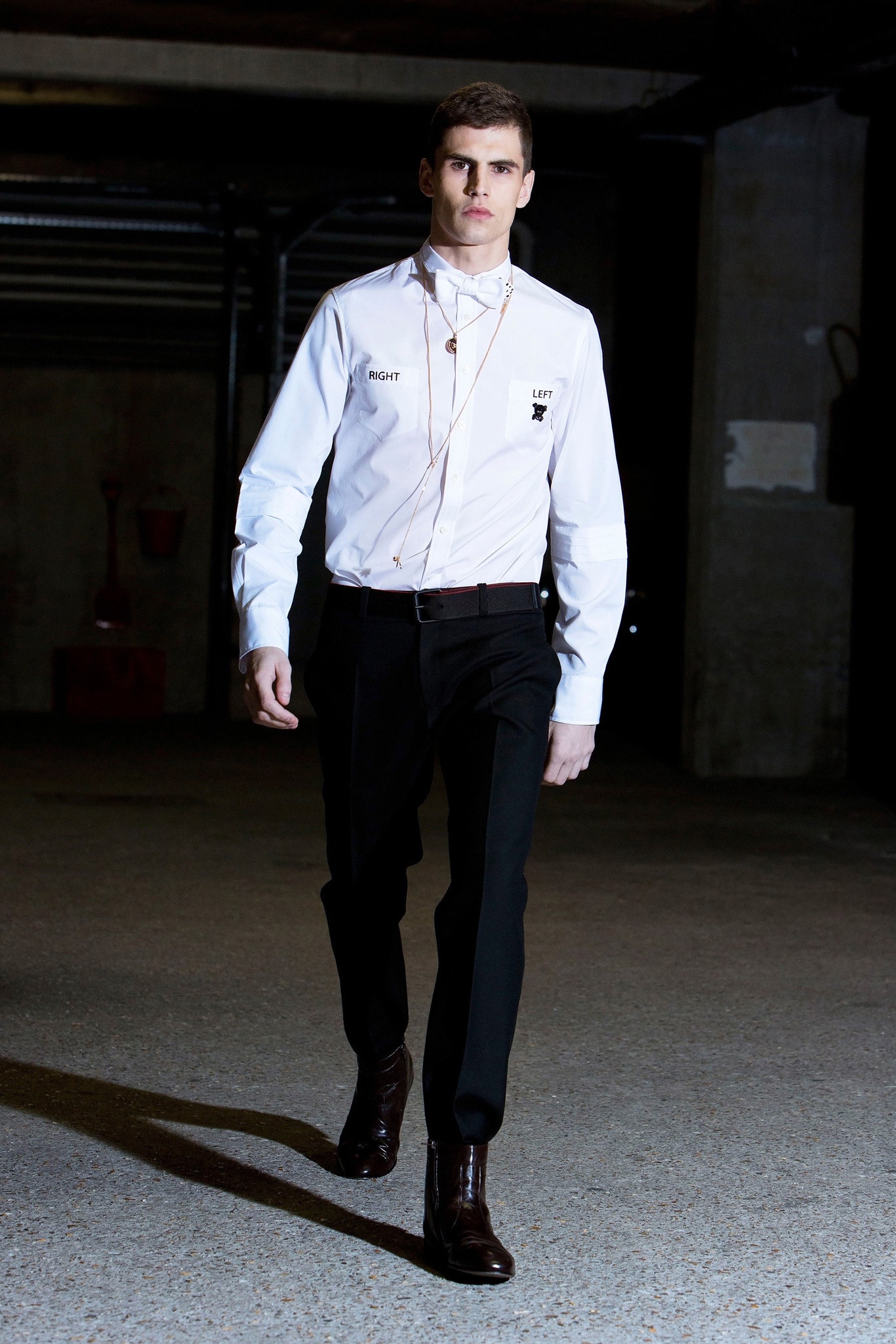 white fitted shirt and black pants