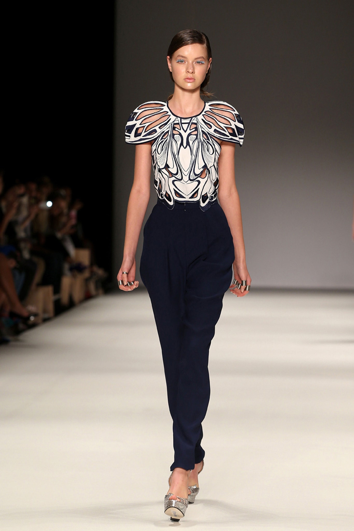 embroidered white and blue top with tailored navy pants
