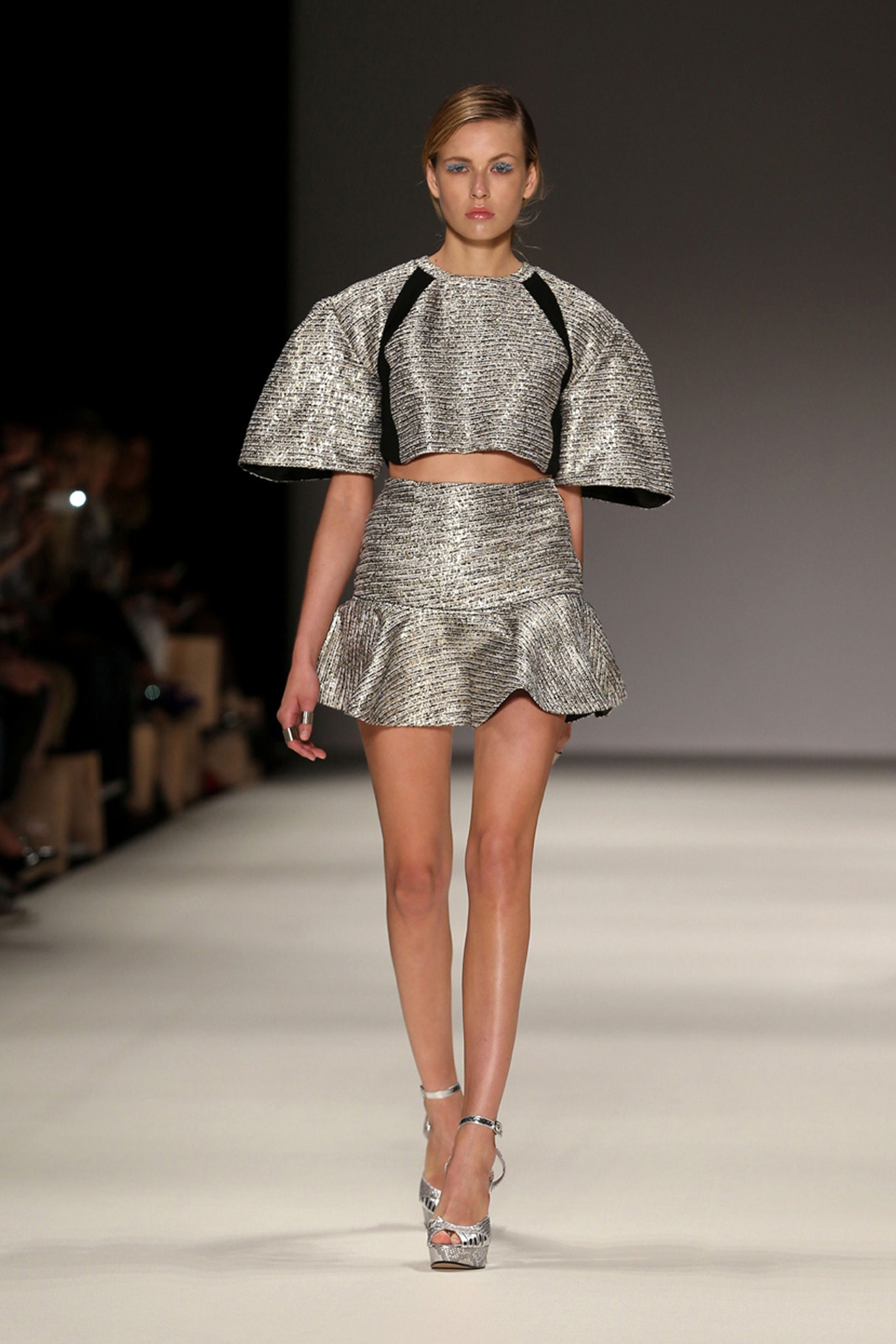 silver metallic crop-top and mini skirt