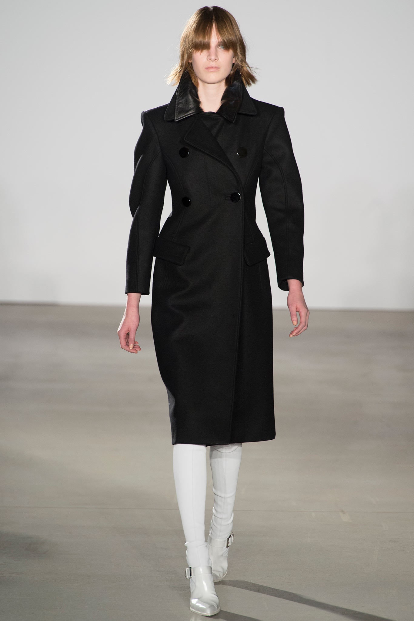 black wool coat with white pants