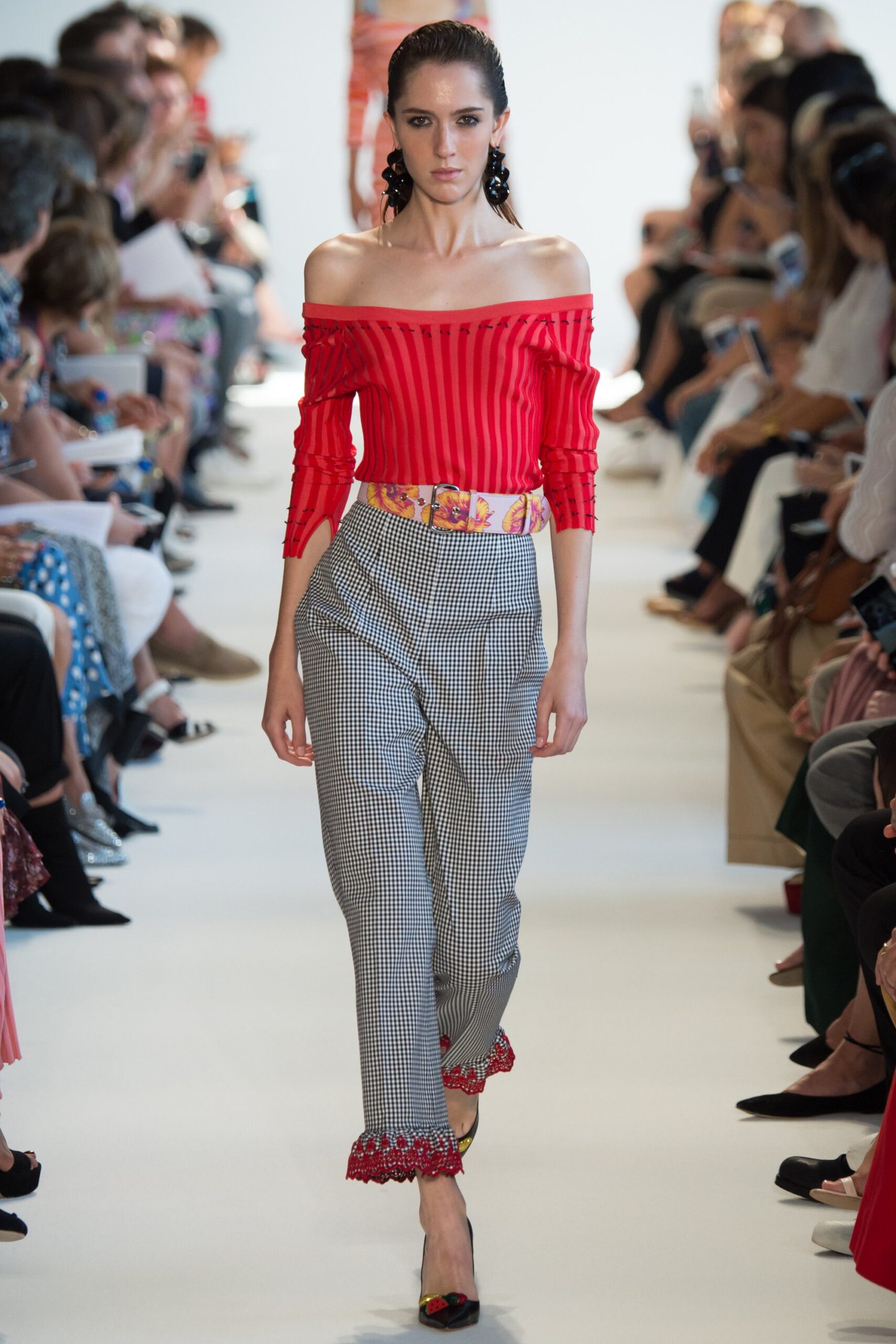 red off-shoulder top with tailored pants