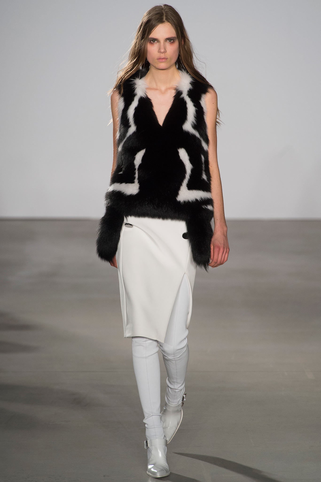 black and white fur vest with leather skirt