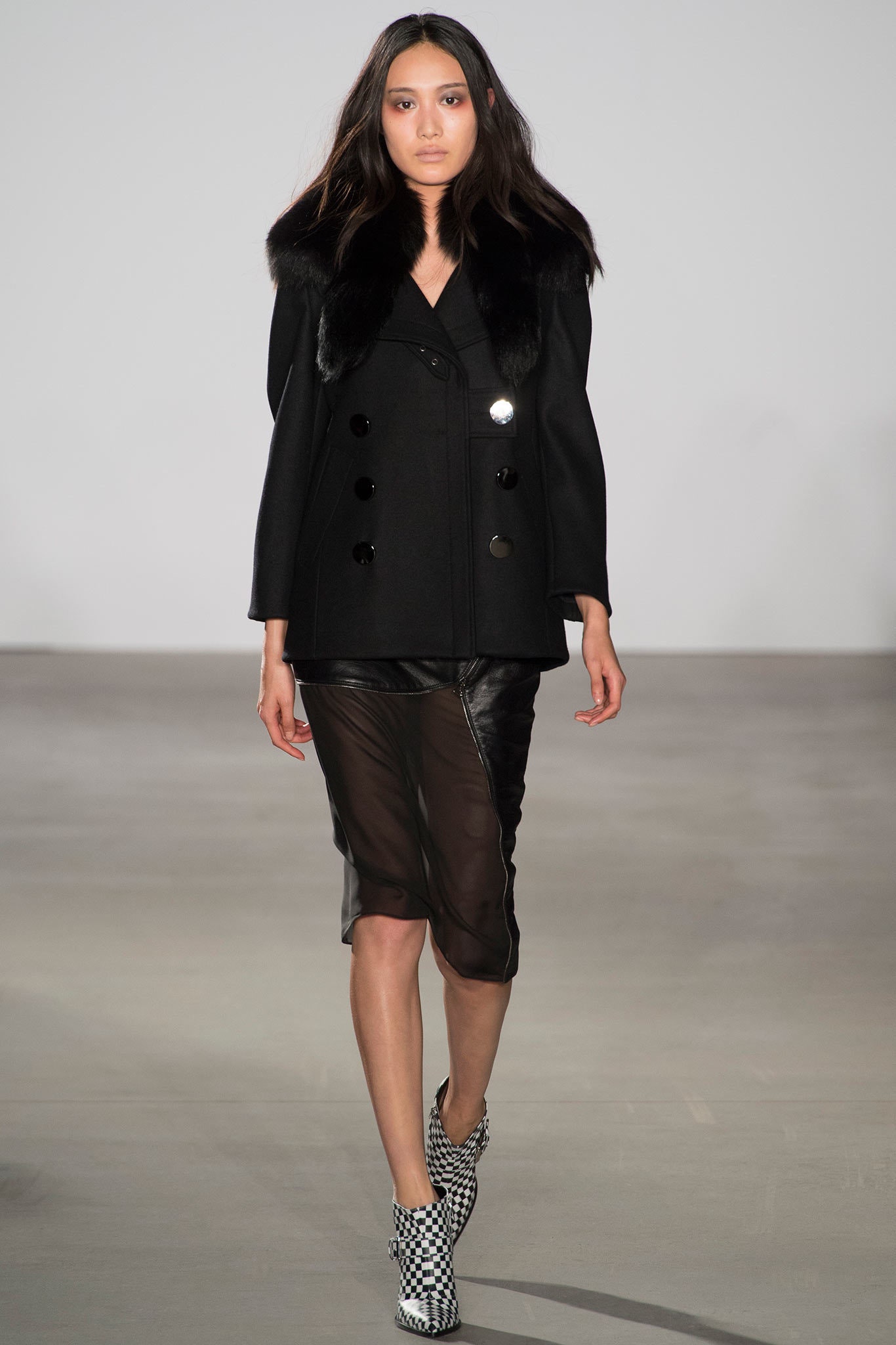 black wool coat and leather skirt