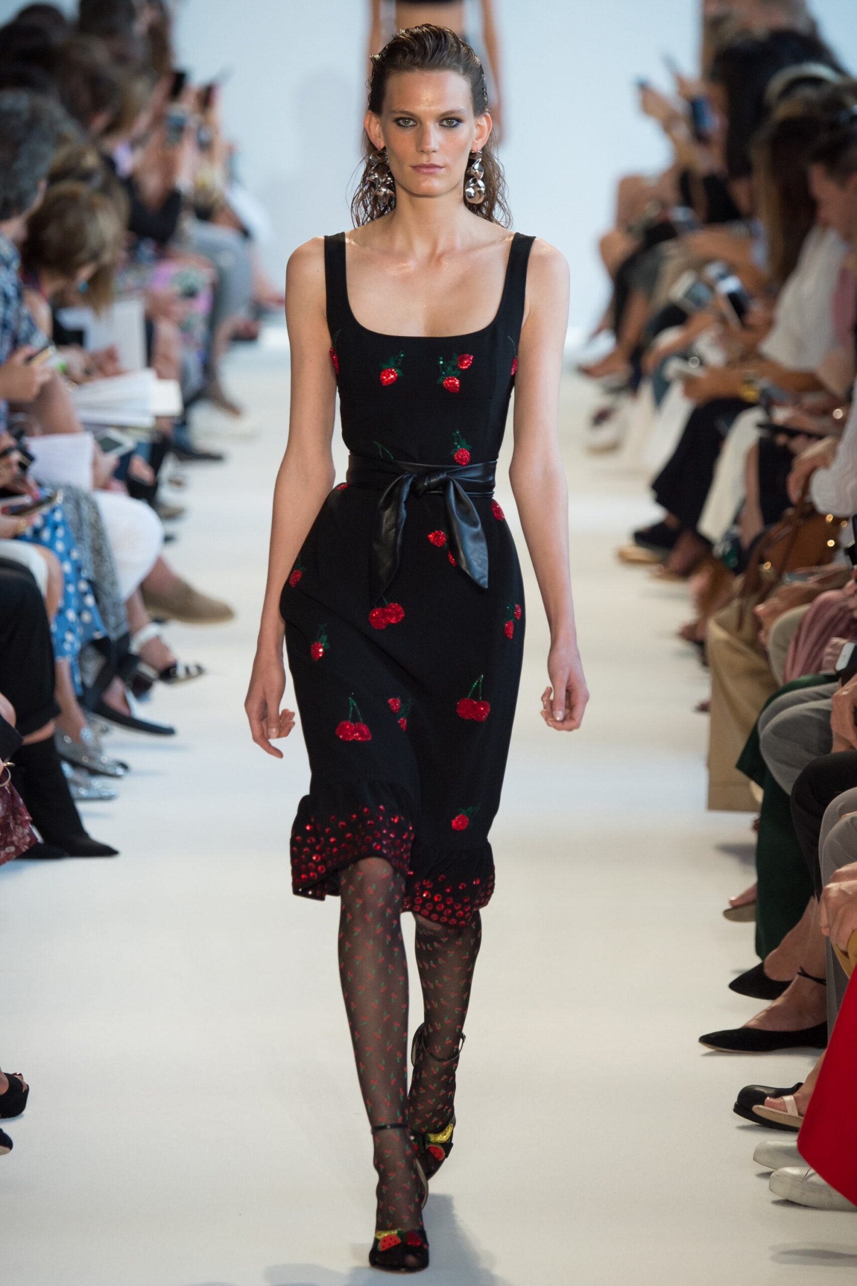 black fitted midi dress with polka-dot tights