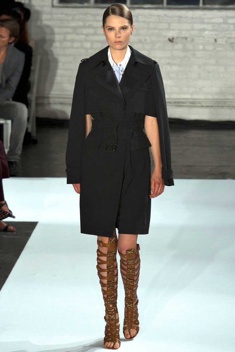 black fitted coat with brown laced shoes