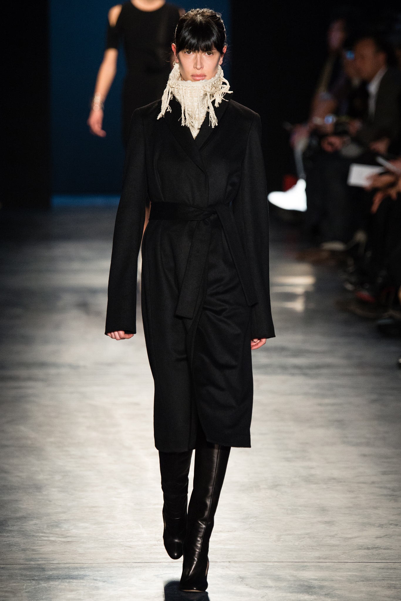 black wool coat with white scarf