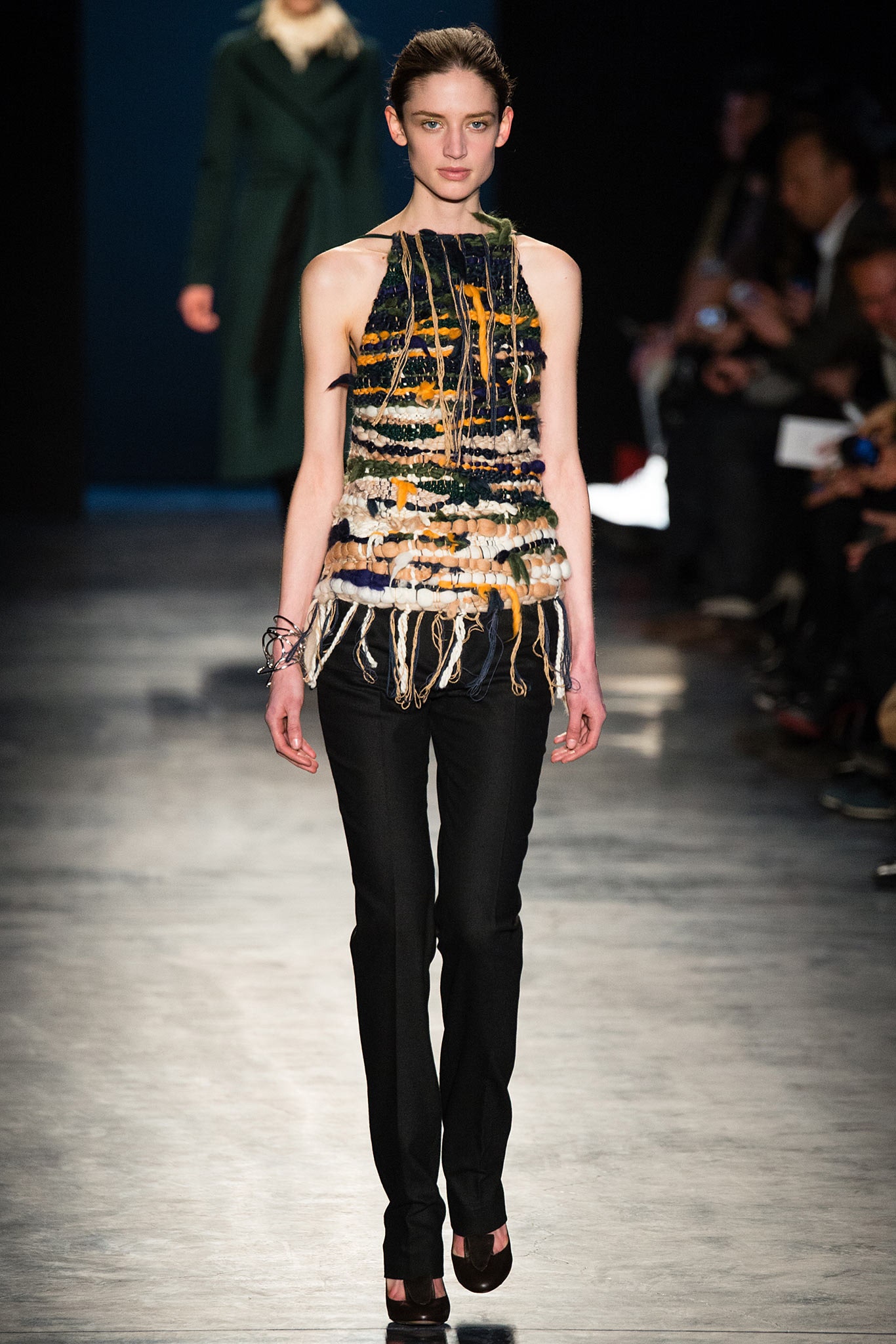 multi-colored sleeveless top with black pants
