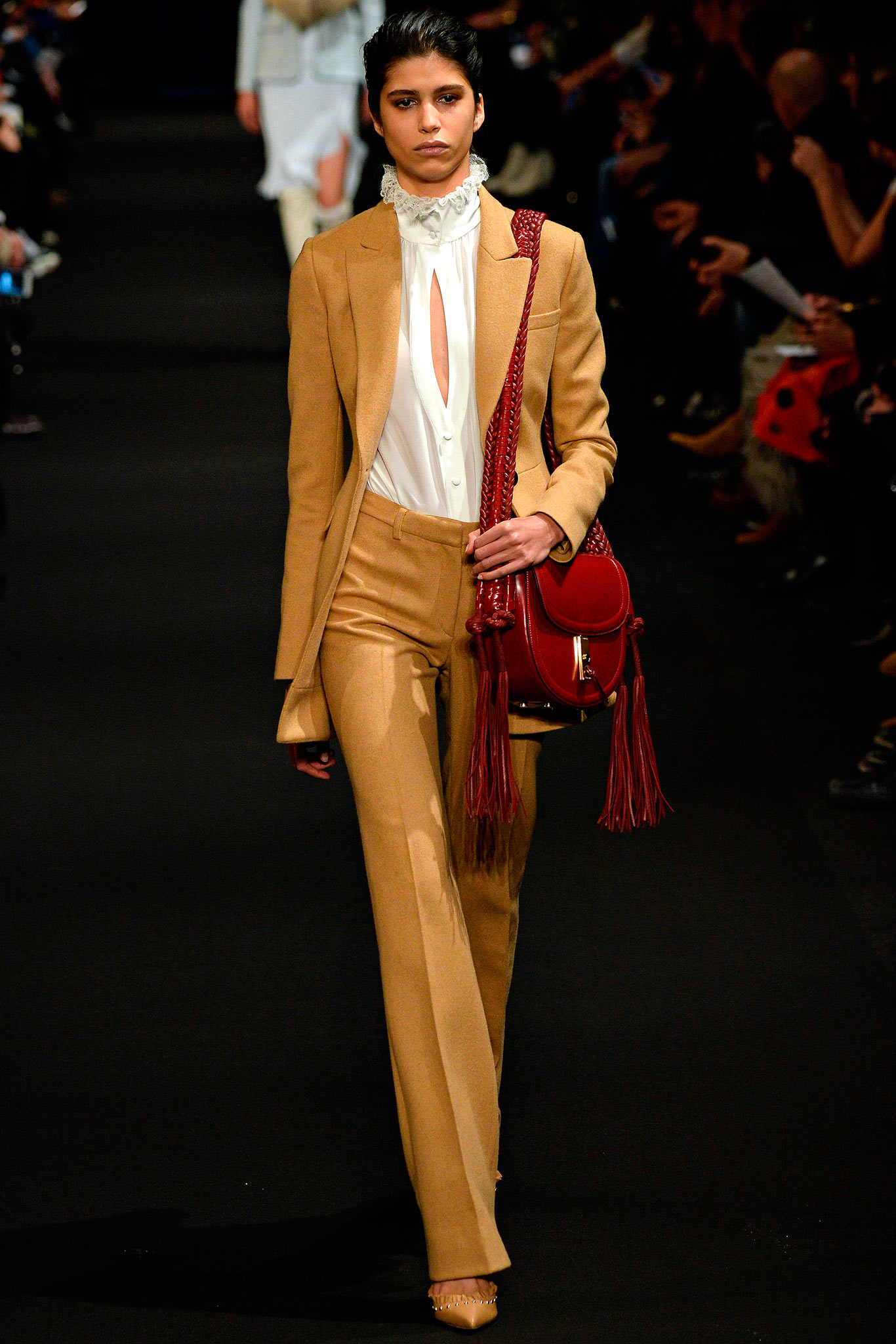 beige tailored suit with white shirt