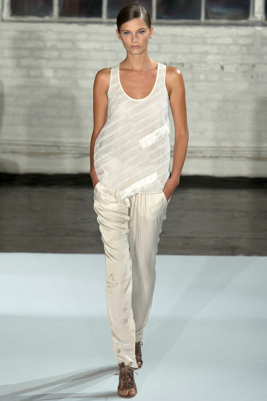 white mesh tank-top and beige pants