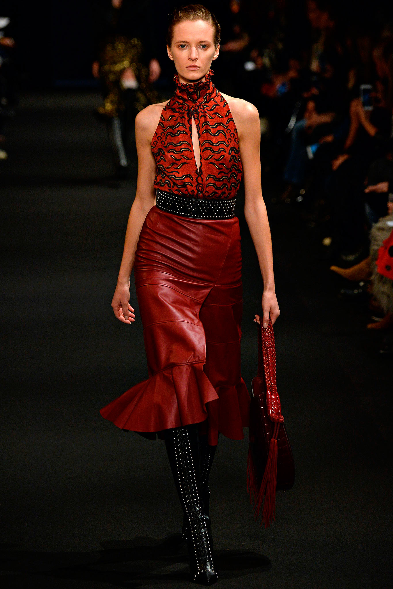 red silk top with flared leather skirt