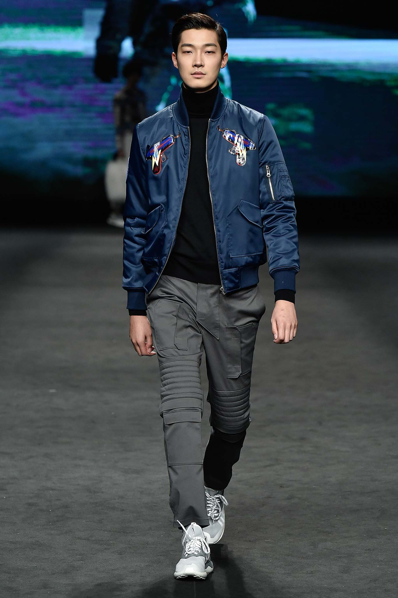 blue fitted jacket with gray pants