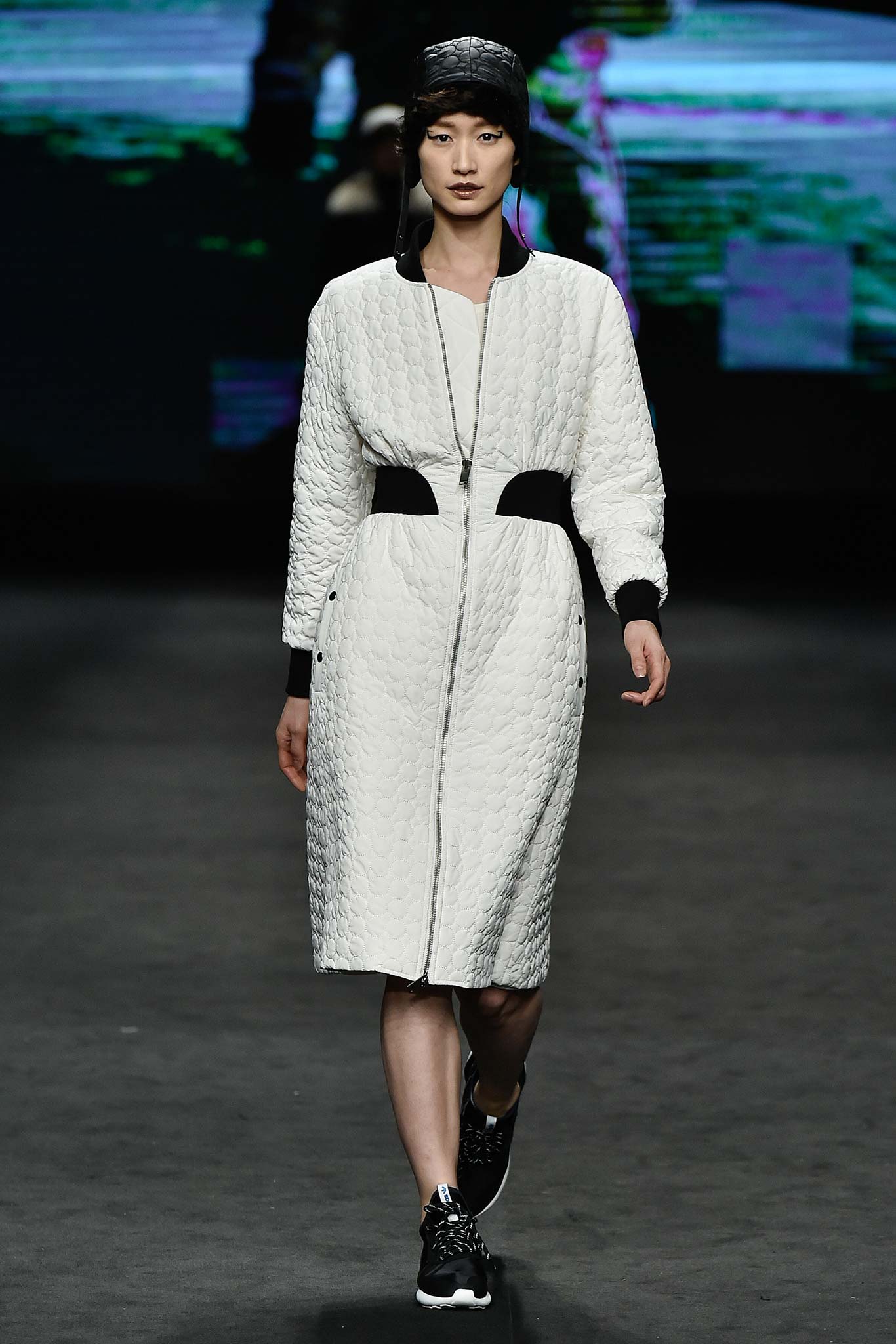 white quilted midi coat with sneakers