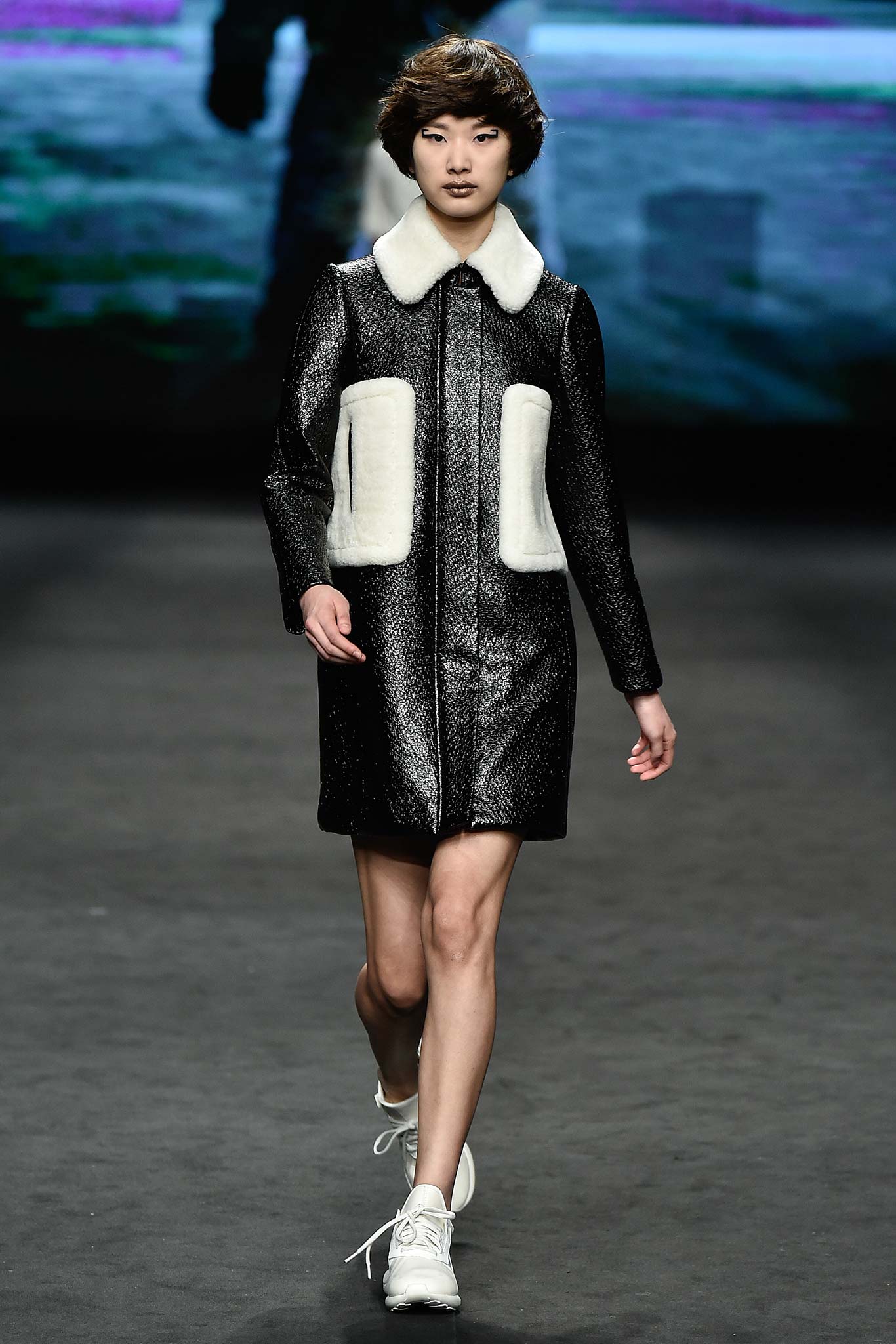 black leather coat with white details