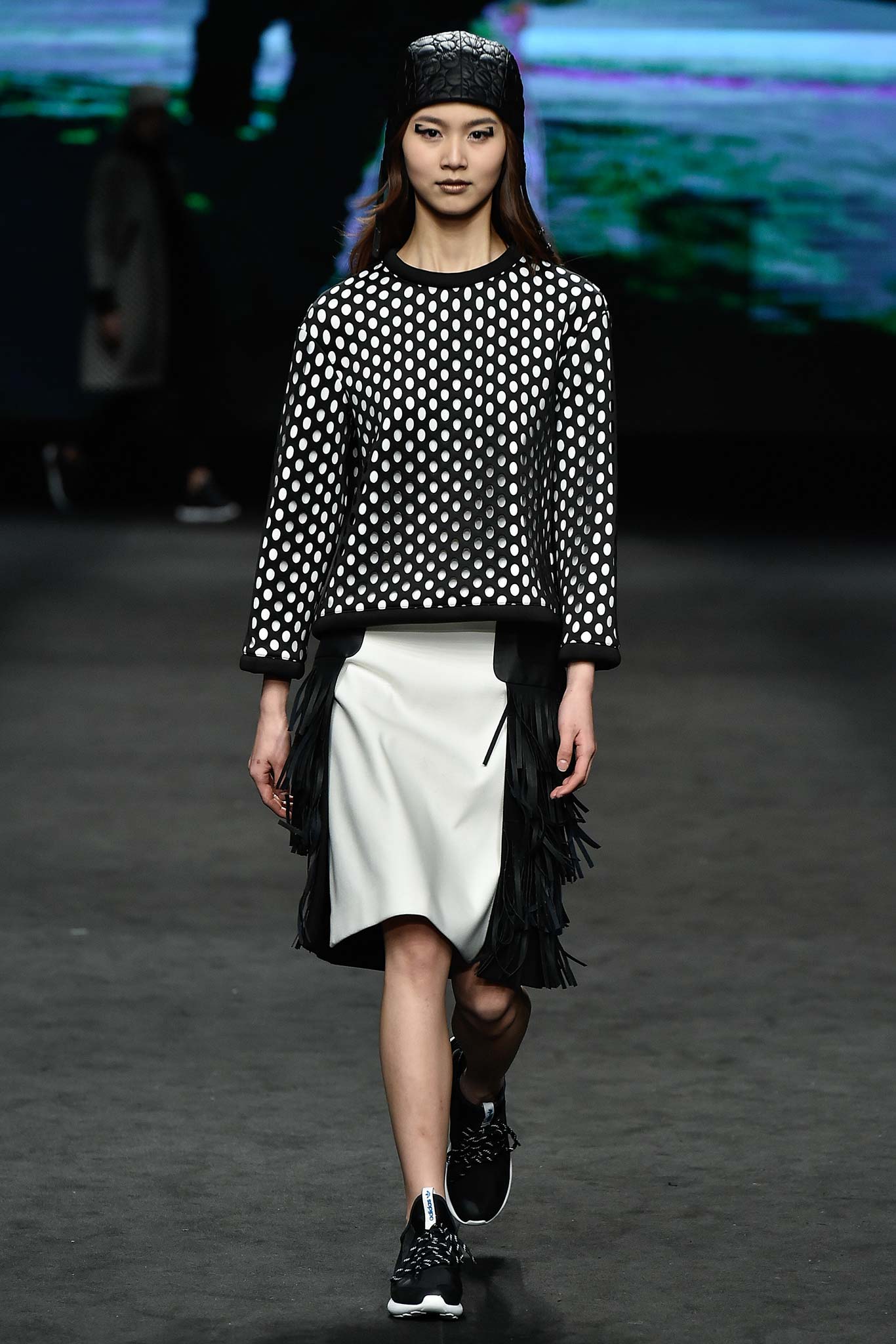 black and white polka-dot top with fringed skirt