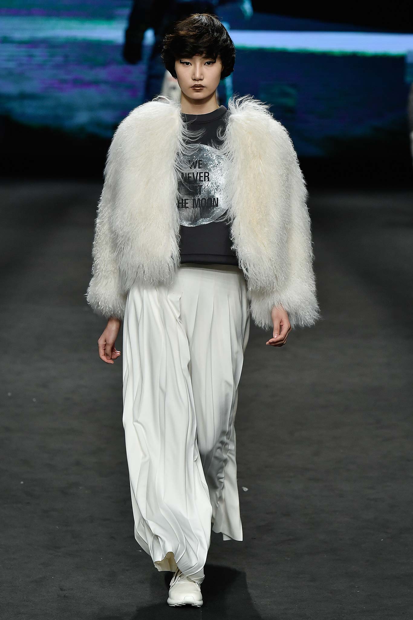 white faux-fur jacket gray top white pants