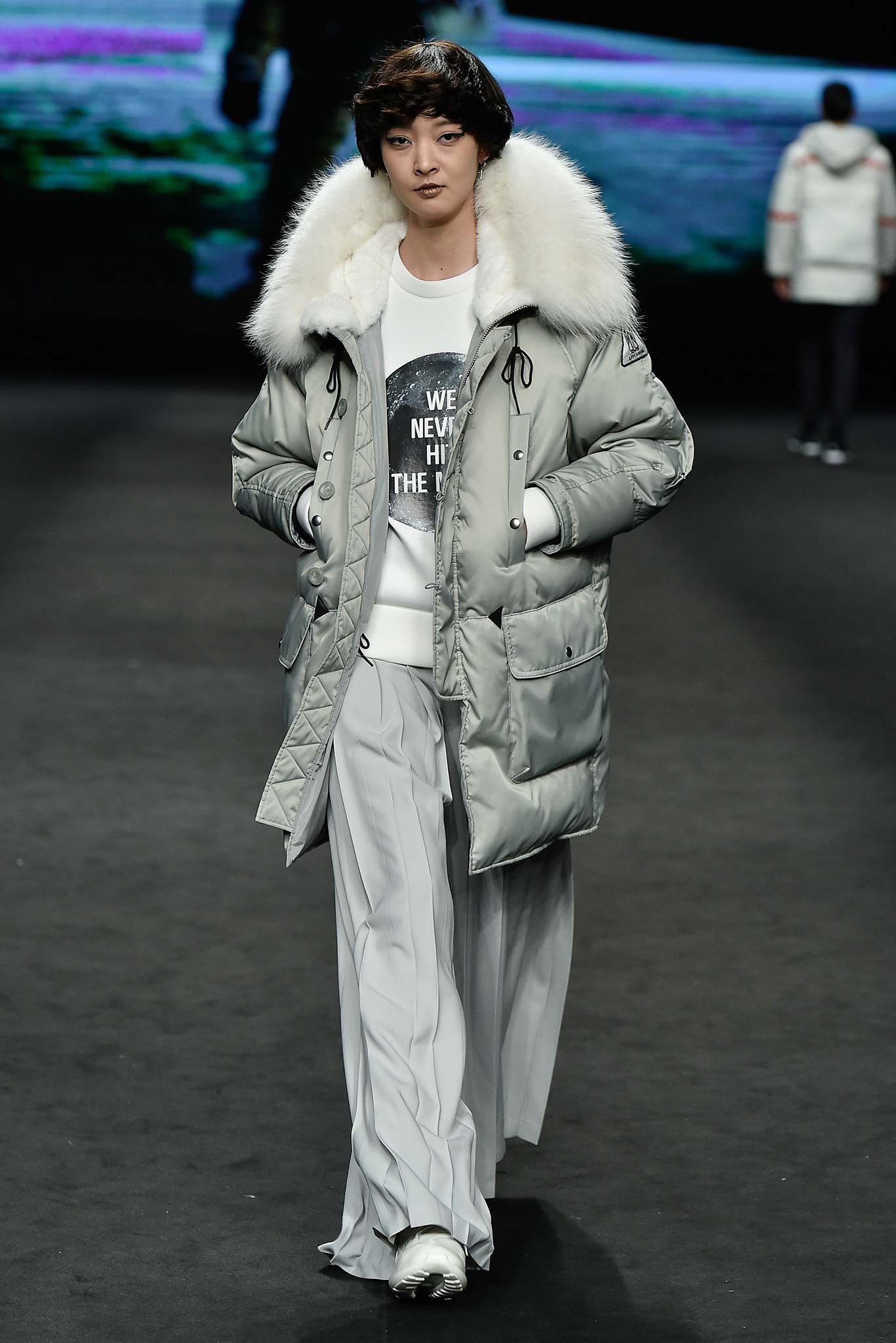 gray parka with white sweater