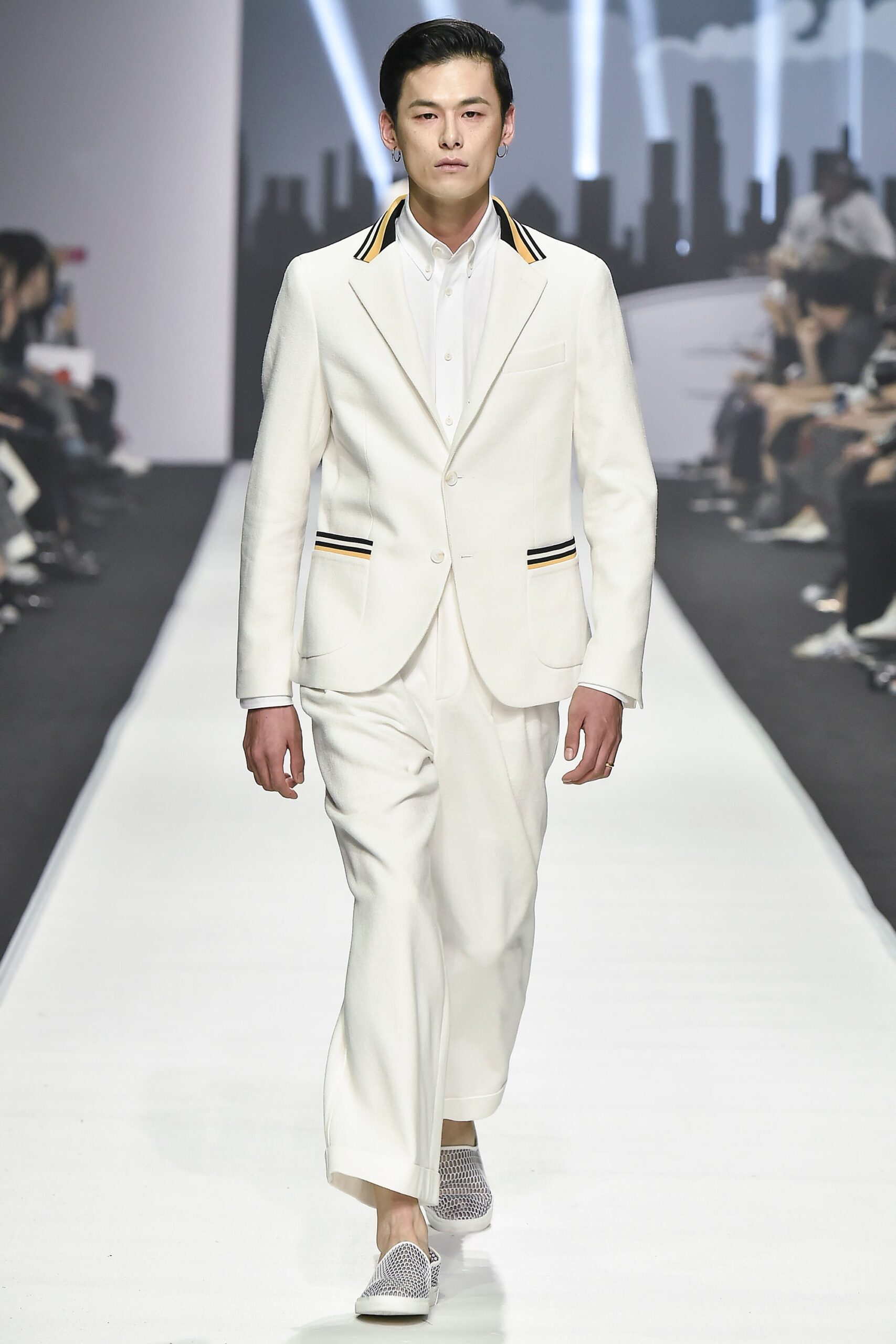 white tailored suit with gray shoes