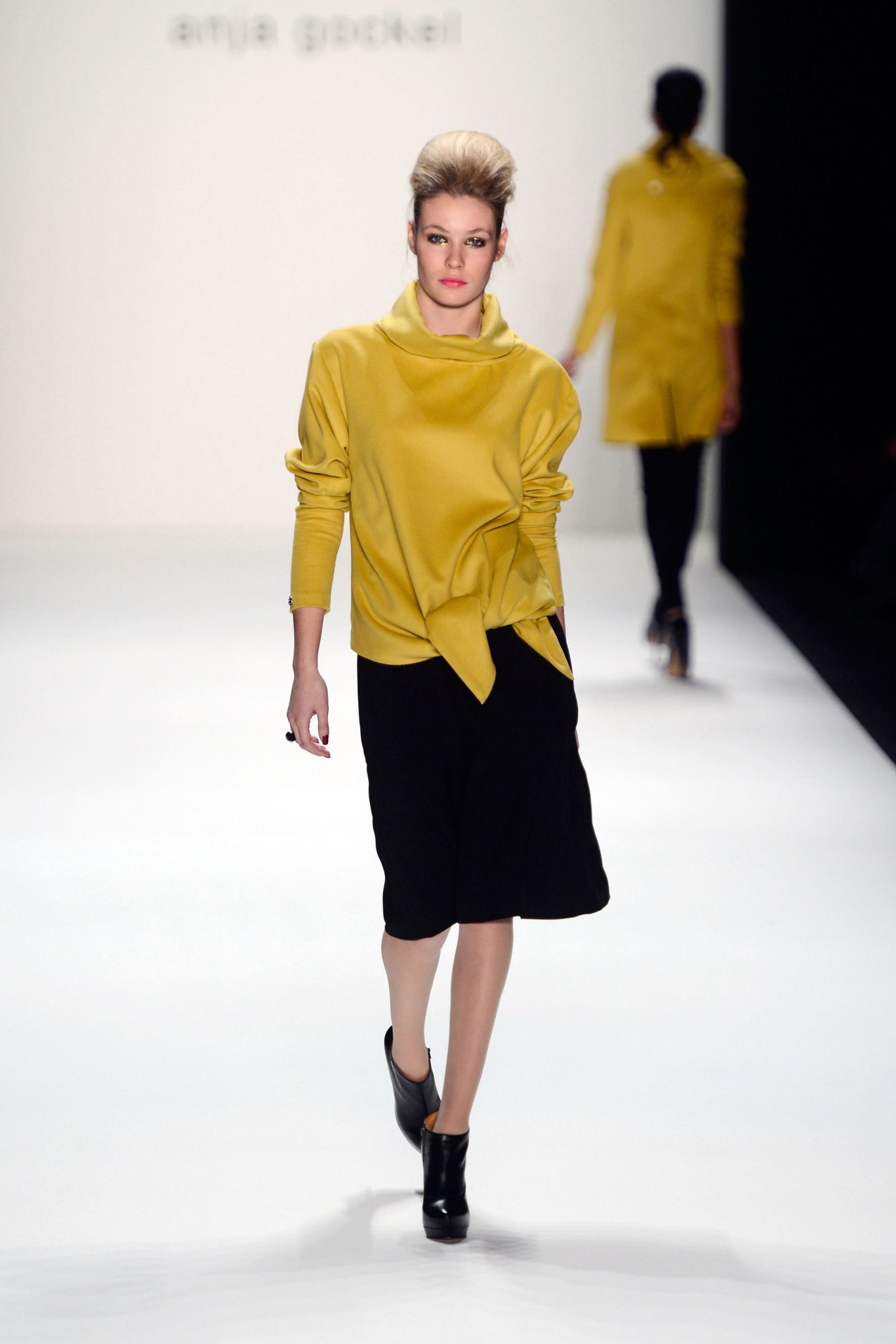 yellow relaxed top with black skirt