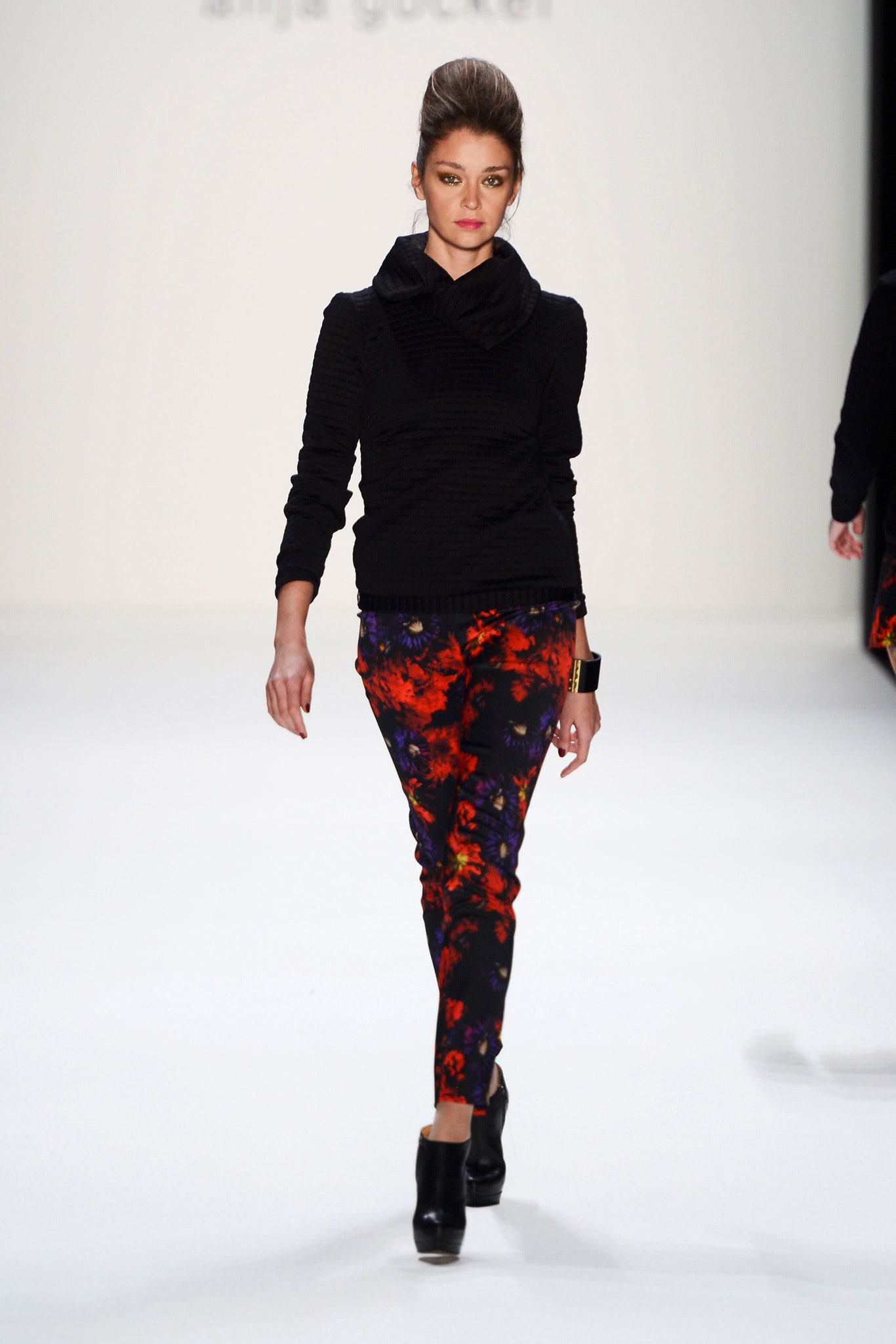 black fitted top with floral pants
