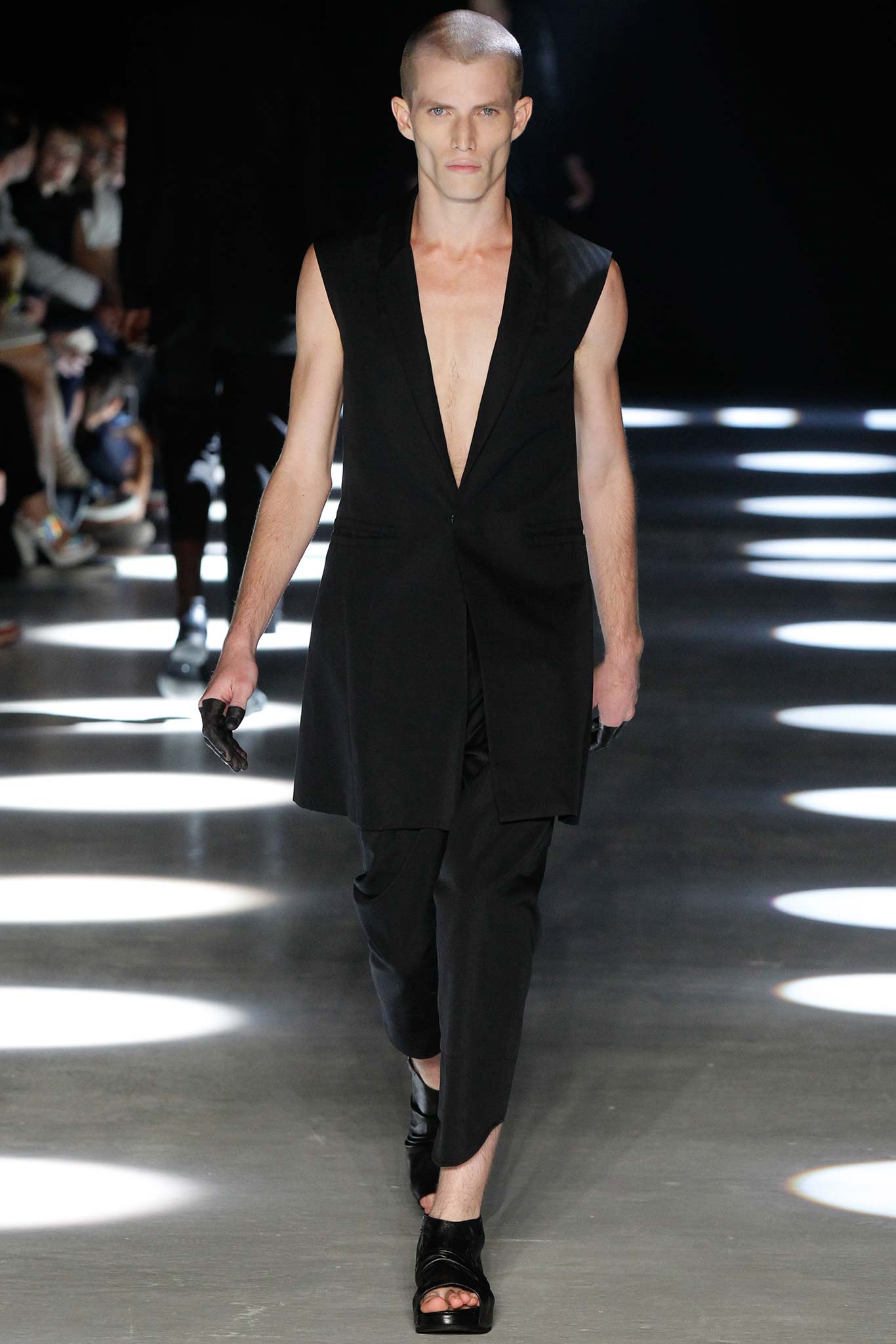 black fitted vest and slim pants