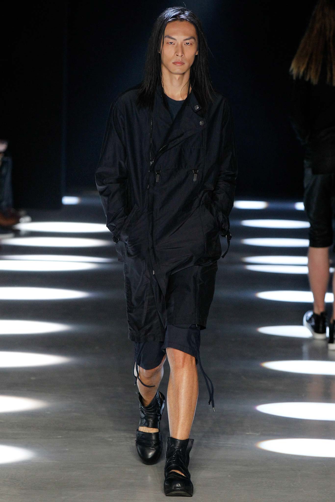 black relaxed coat with fitted shorts