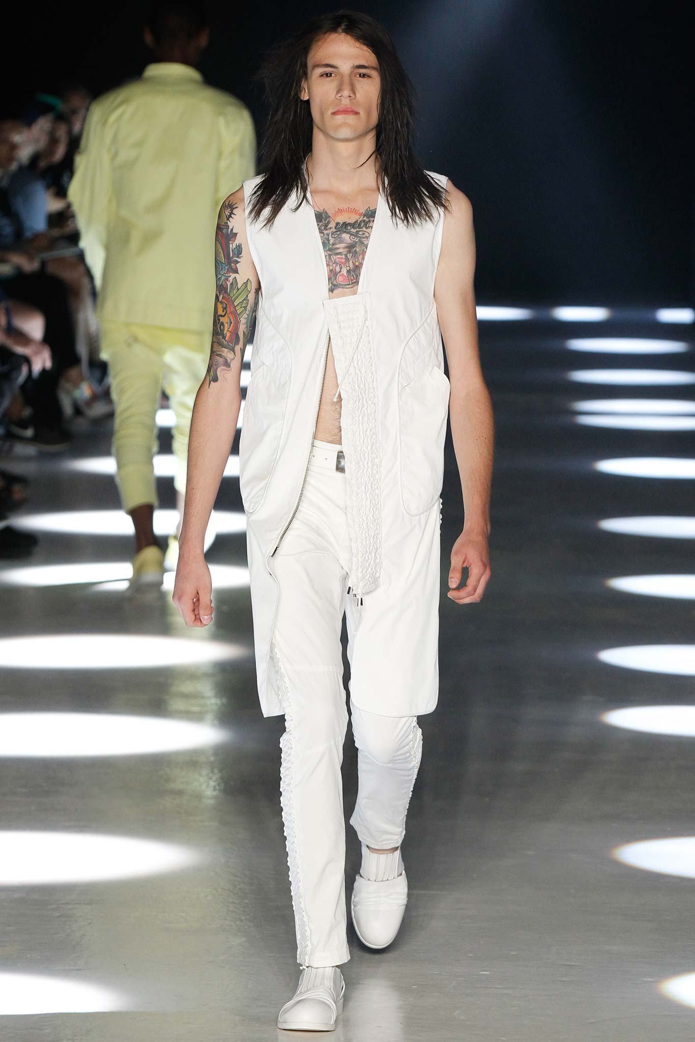 white relaxed vest with slim pants