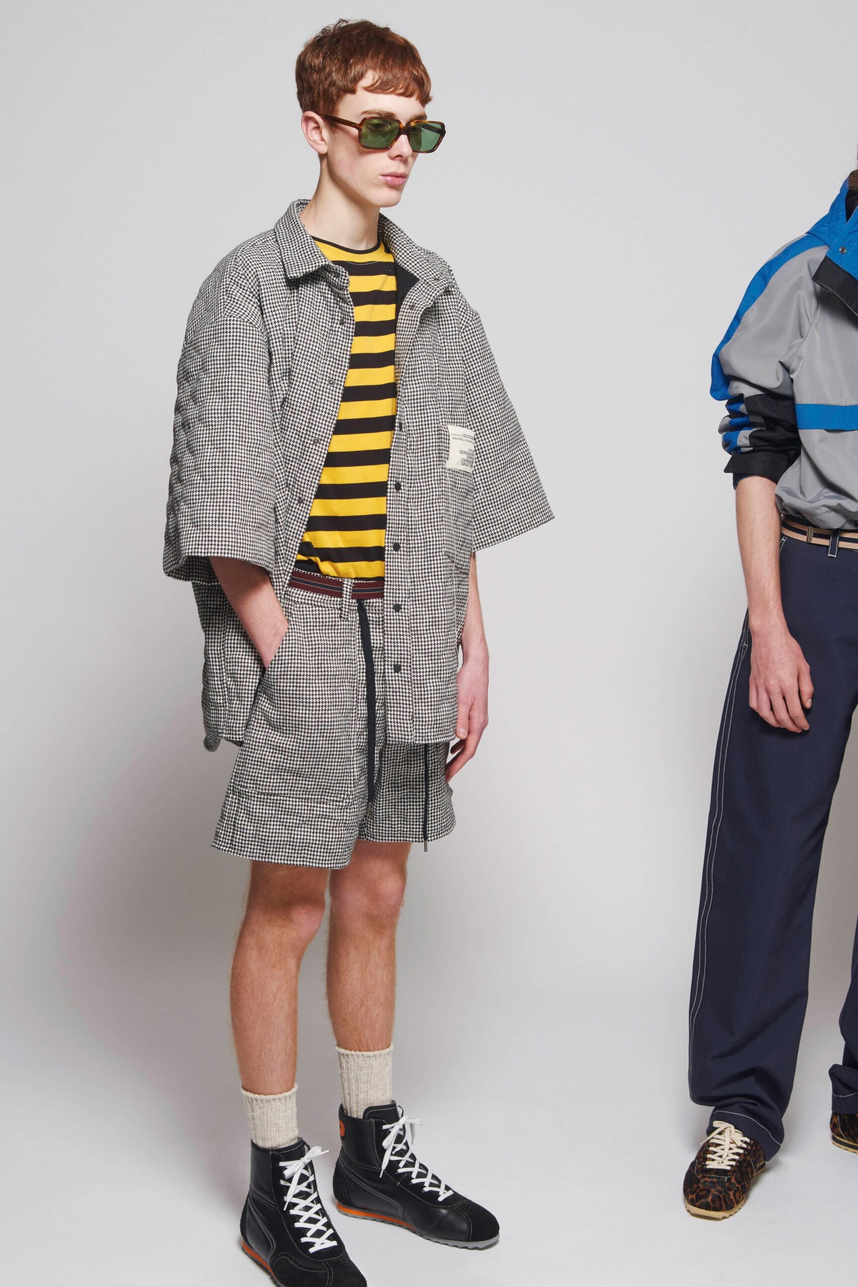 black and yellow striped shirt with checked shorts