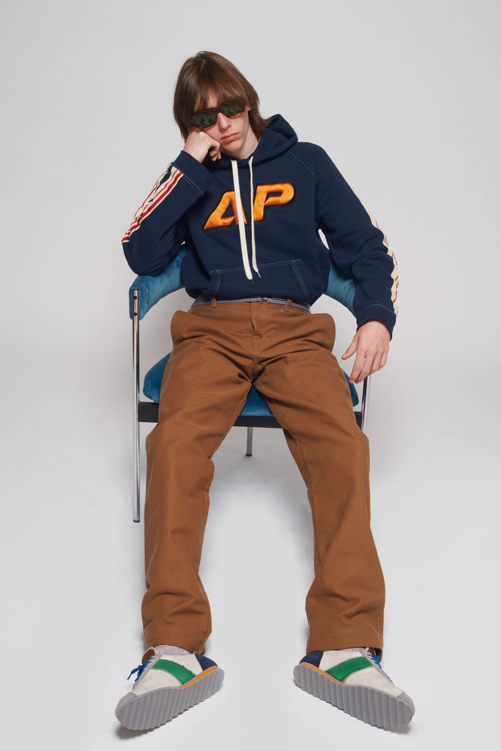 navy hoodie with brown pants