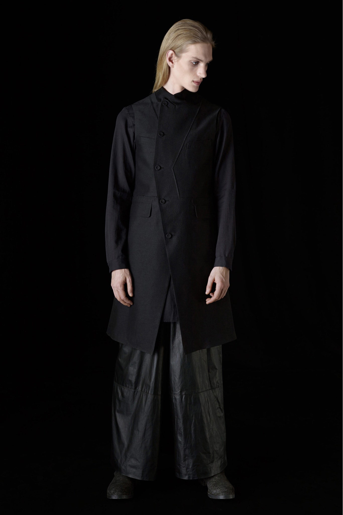 black fitted vest with relaxed pants