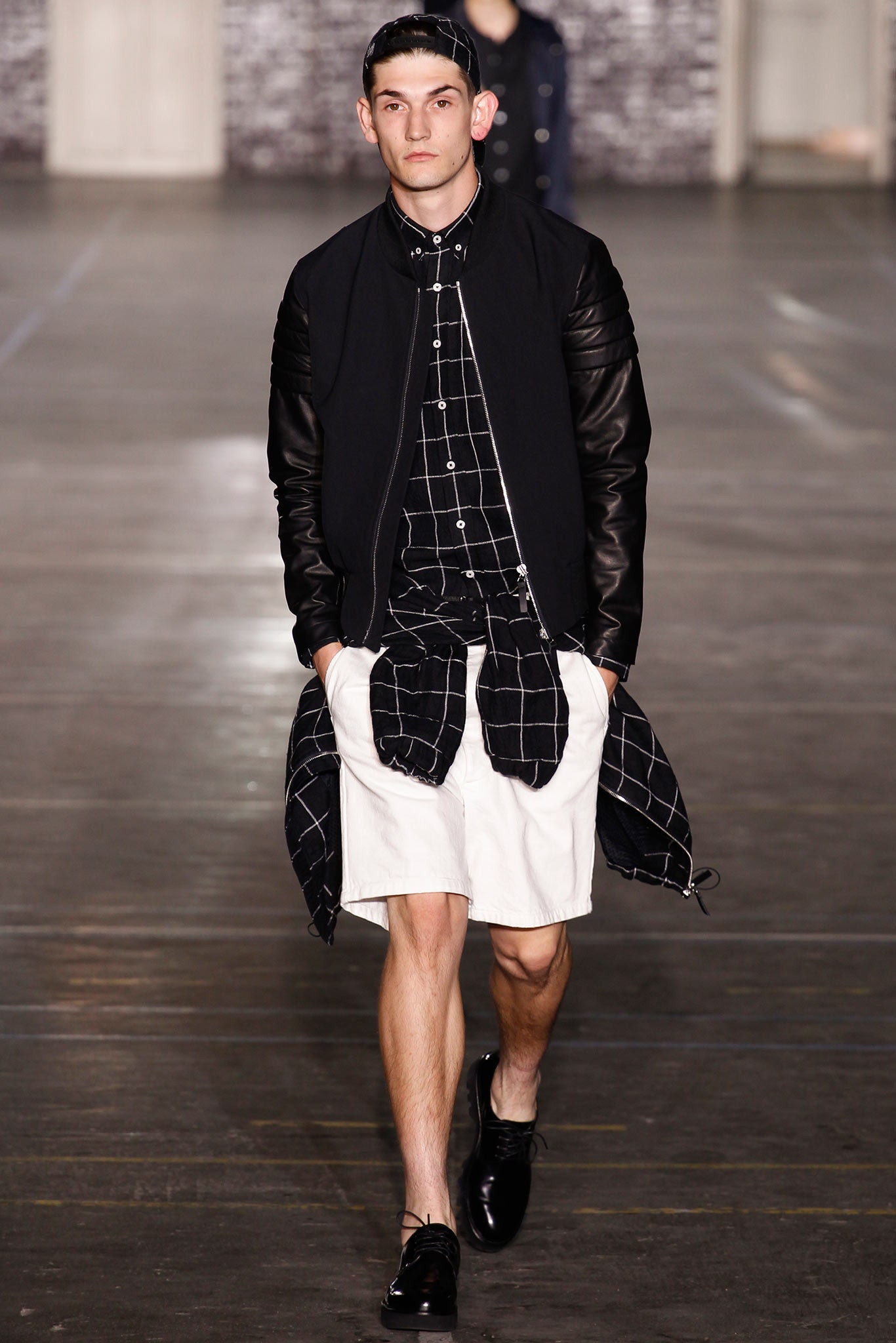 black jacket with checked shirt and shorts