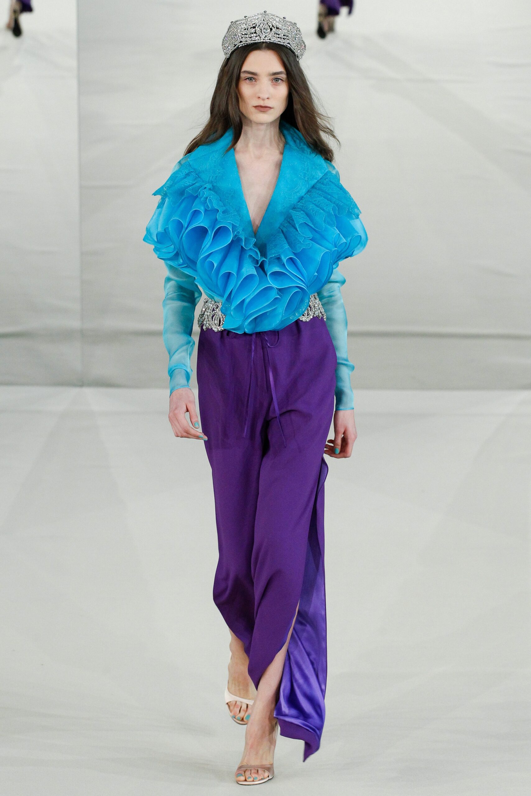 blue ruffled top with purple pants