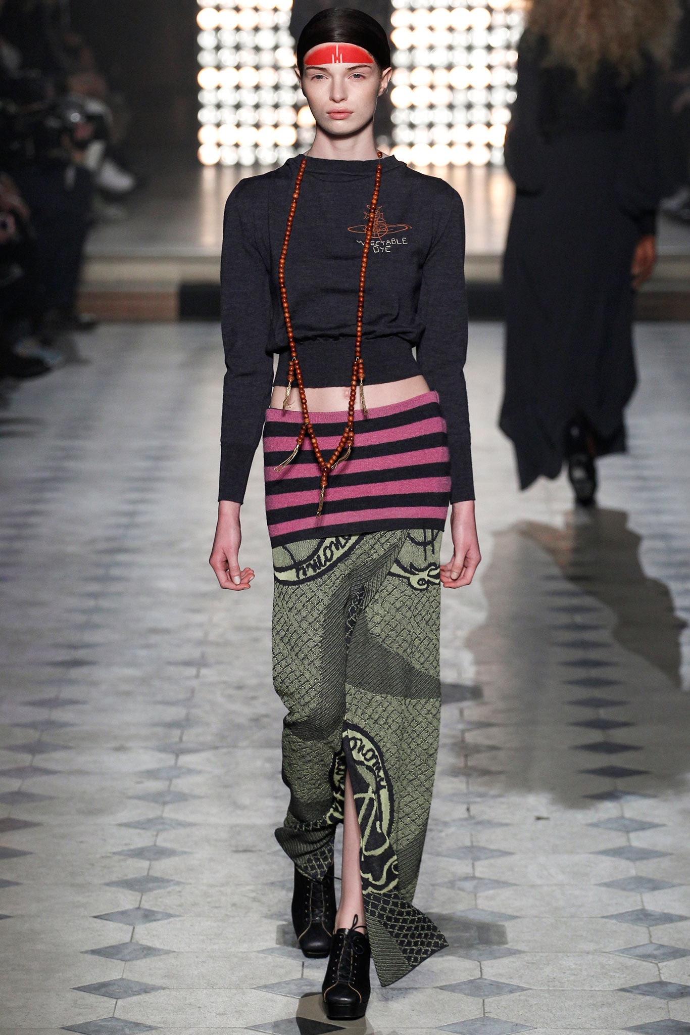 black fitted top with striped skirt