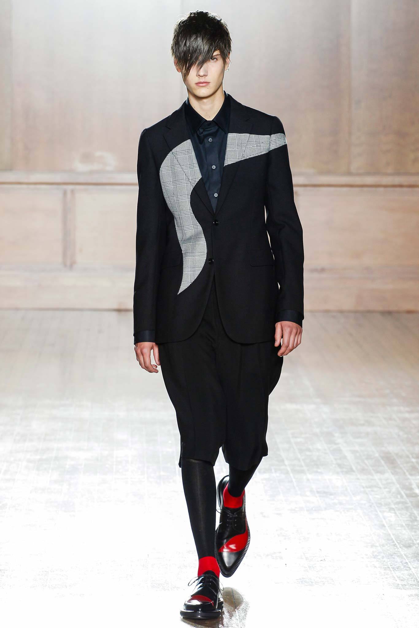 black tailored suit with asymmetric detail