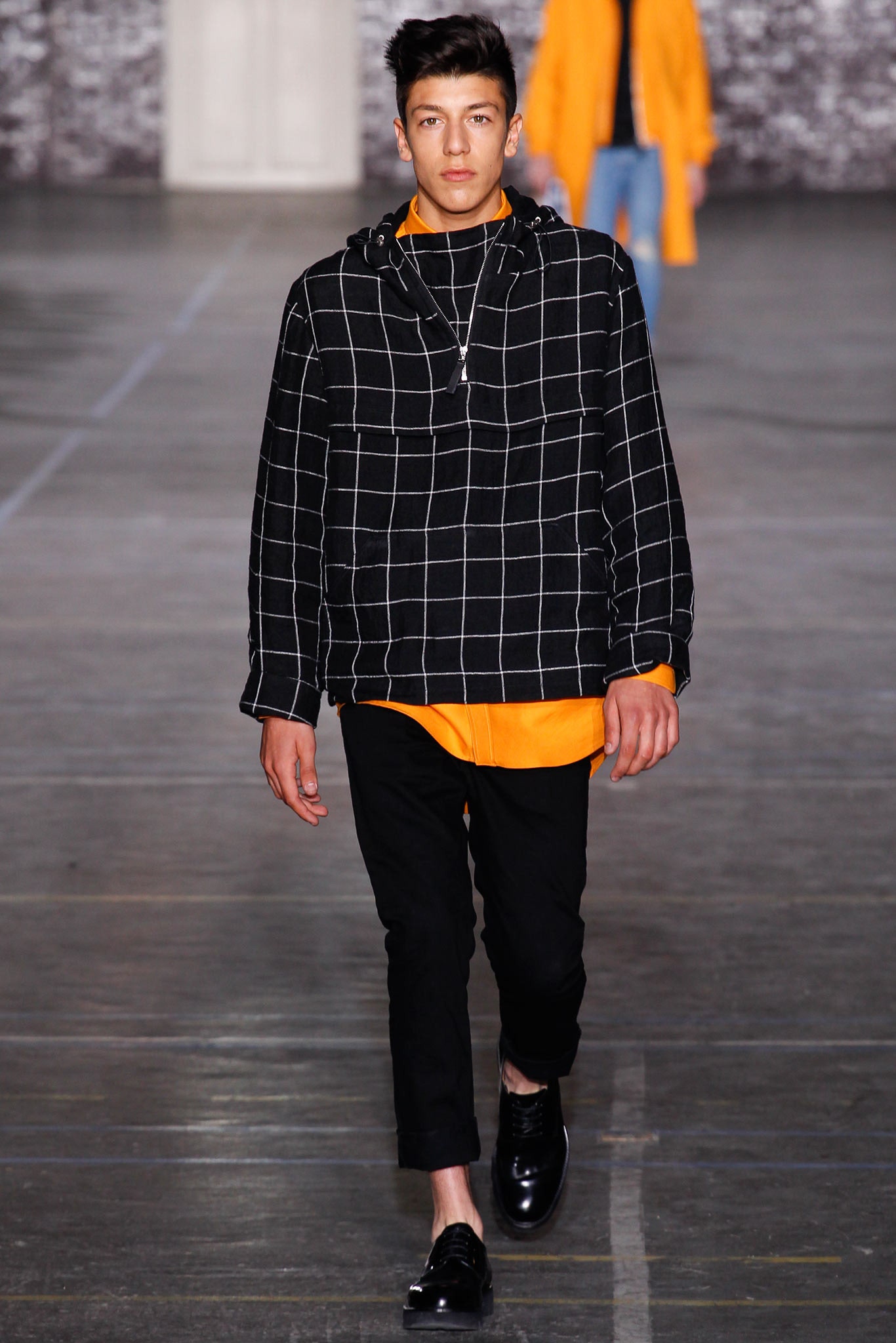 black and white checked hoodie with orange shirt