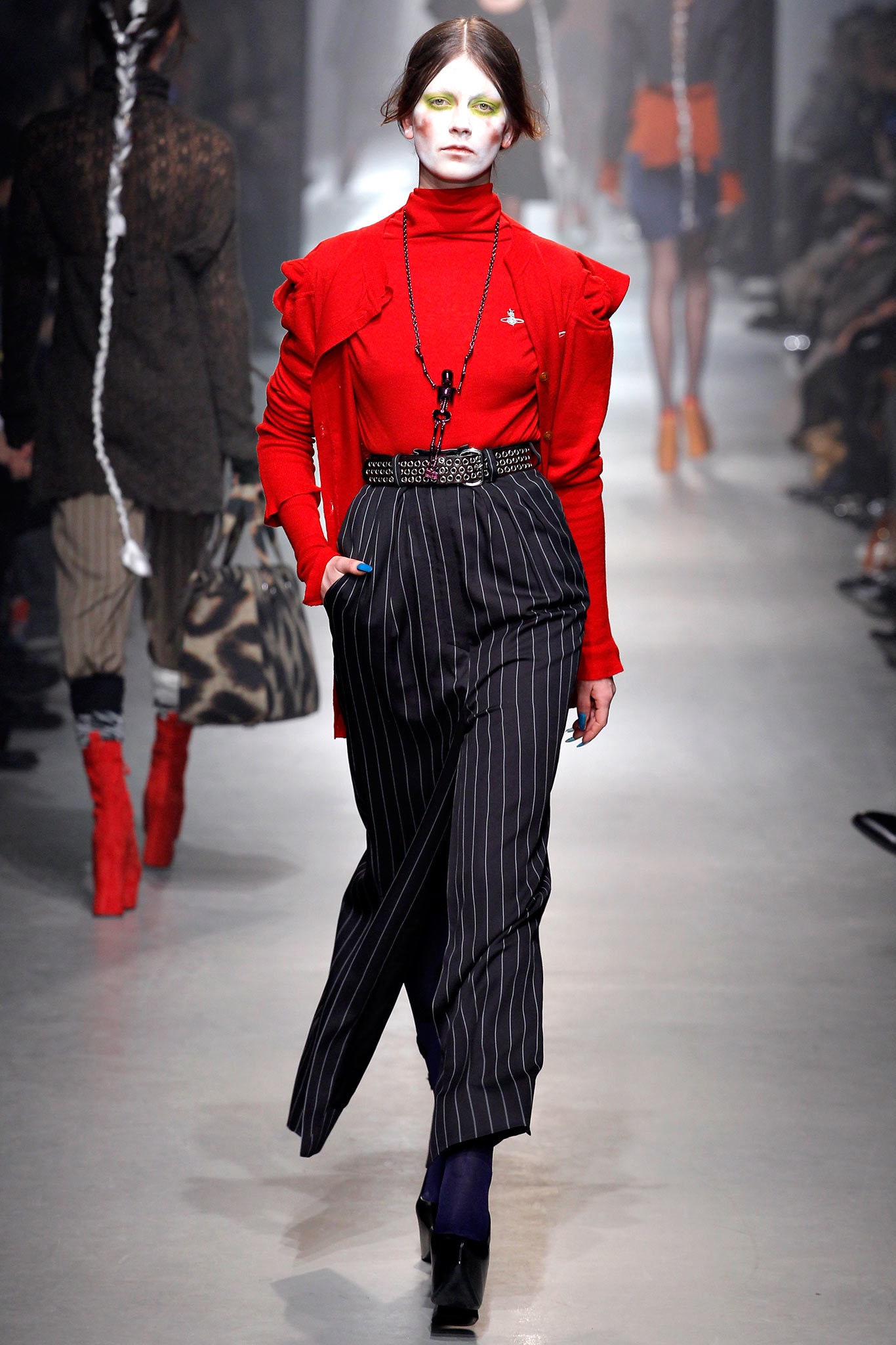 red fitted top with striped pants
