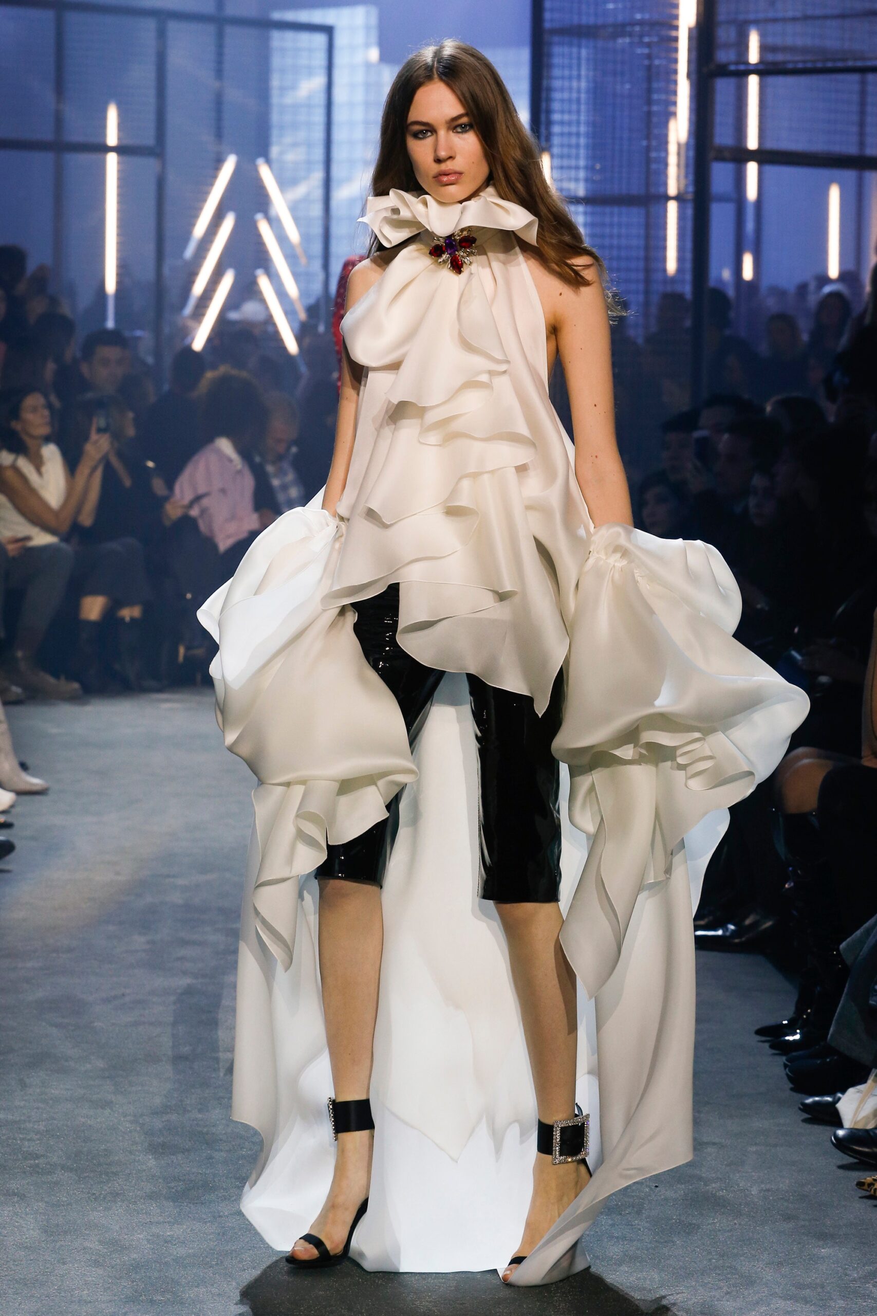 white silk sleeveless high-neck fitted ruffled flowing dress